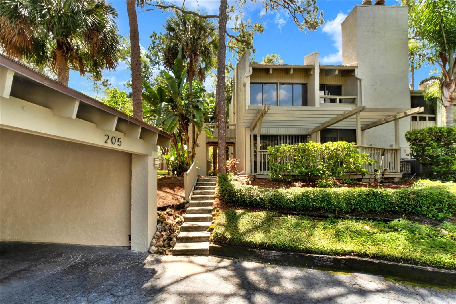 THE SPRINGS LIFESTYLE AT AN UNBEATABLE VALUE
Imagine waking up in the heart of one of Longwood’s most coveted gated enclaves. This ground-floor, end-unit retreat in Fairway Villas offers more than just a home; it offers a total lifestyle transformation. Whether you are seeking a peaceful "lock-and-leave" residence or upgrade, this condo delivers a rare combination of character, comfort, and privacy.

CHARECTER & COMFORT
The open-concept layout is anchored by soaring wood-beamed ceilings, creating an atmosphere that is both rustic and modern.  Features sliding glass doors that lead to your massive private deck, perfect for morning coffee or hosting friends under a canopy of mature trees.

PREMIUM UPDATES
Enjoy the peace of mind that comes with updated counters, solid surface finishes, and the convenience of a primary suite located entirely on the main floor. As an end unit, you benefit from additional natural light and enhanced privacy that other units simply don't offer.

WORLD-CLASS AMENITIES
You aren't just buying a condo; you’re gaining 24-hour gated security and access to The Springs' legendary amenities: a private clubhouse, fitness center, tennis courts, community stables, and a natural spring for swimming.

ACT FAST
Properties at this price point within The Springs are a rare find. Maintenance fees are all-inclusive, covering water, exterior upkeep, 24/7 security, and all recreational facilities.

Schedule your private showing today. Welcome home!
