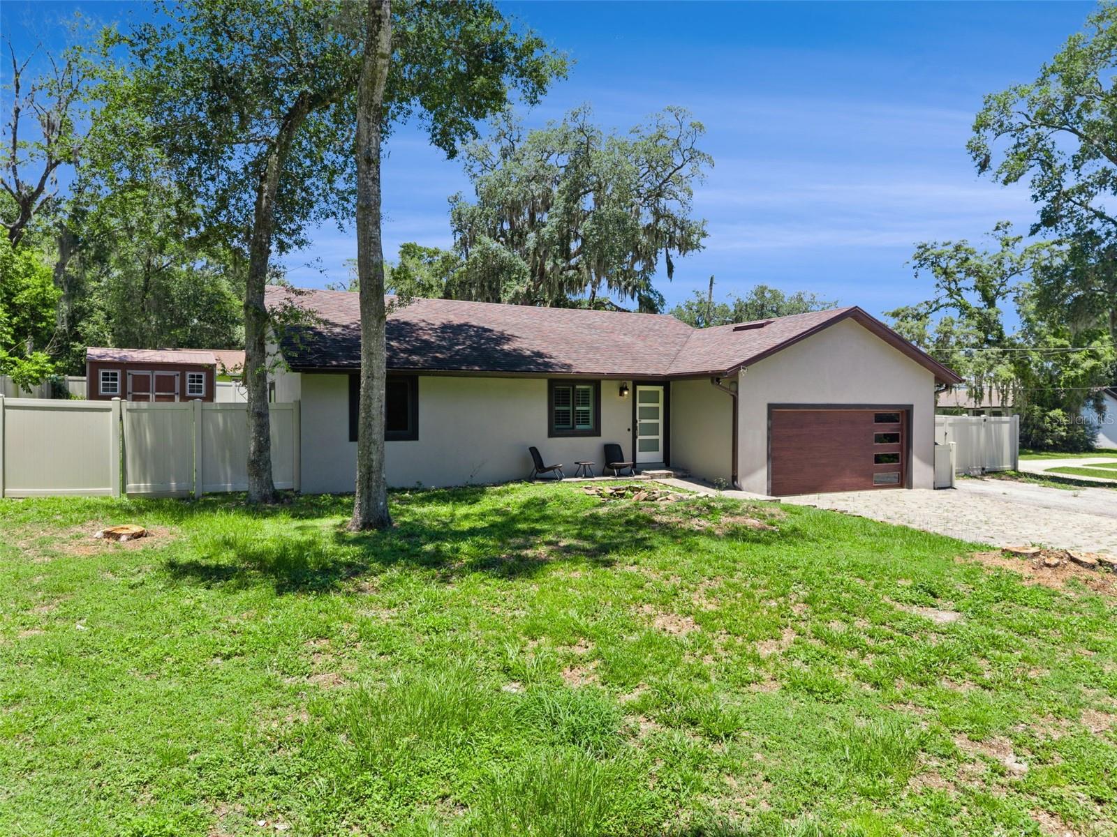 Welcome home to this beautifully updated property on nearly 1/3 acre with no HOA, offering plenty of space, flexibility, and an unbeatable Oviedo location. Just minutes from Oviedo on the Park, shopping, dining, and entertainment.
The heart of the home is the stunning remodeled kitchen with a large quartz island, stainless steel appliances, soft-close cabinetry, quartz countertops, subway tile backsplash, and abundant storage. The open-concept layout creates the perfect space for family time, entertaining, or working from home.

A unique highlight is the private in-law suite with its own entrance and full bathroom  ideal for multigenerational living, a home office, playroom, media room, or guest space.

Additional features include remodeled bathrooms, plantation shutters, vaulted ceilings, impact windows, vinyl fencing, brick paver driveway, spacious backyard, storage shed, and extra parking and car lift in the garage.

Enjoy the privacy of a large lot while being close to top-rated schools, parks, restaurants, and everyday conveniences. This move-in-ready home offers the space, comfort, and flexibility today's families are looking for.