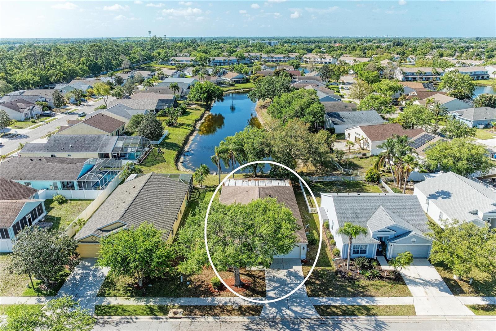 Welcome to your new oasis in the highly sought-after community of Sabal Harbour! This spacious four-bedroom, two-bathroom residence offers an incredible opportunity to create your dream home in a premier location. As you step inside, you are greeted by an expansive living area featuring neutral tones and soaring vaulted ceilings that enhance the sense of openness and light throughout the home. The heart of this floor plan leads you toward the rear of the property, where an enclosed lanai provides the perfect spot to relax while enjoying serene views of the beautiful lake.

Situated in the centrally located Sabal Harbour neighborhood, this property offers an unparalleled lifestyle with access to a resort-sized swimming pool, tennis courts, a basketball court, and a wonderful playground. One of the standout features of this community is that the use of these fantastic amenities is included in a remarkably low HOA fee of only $69 monthly, with the added benefit of no CDD fees.

The location is truly unbeatable, placing you just minutes away from world-rated beaches and a vast array of premier shopping and dining options. Families will appreciate being located within an A-rated school district, providing excellent educational opportunities. Peace of mind comes standard here, as the property is not in a flood zone. Whether you are looking for a primary residence or a savvy investment, this home combines a functional layout with an amazing community atmosphere in one of the area's most convenient locations. Schedule your showing today and imagine the possibilities!