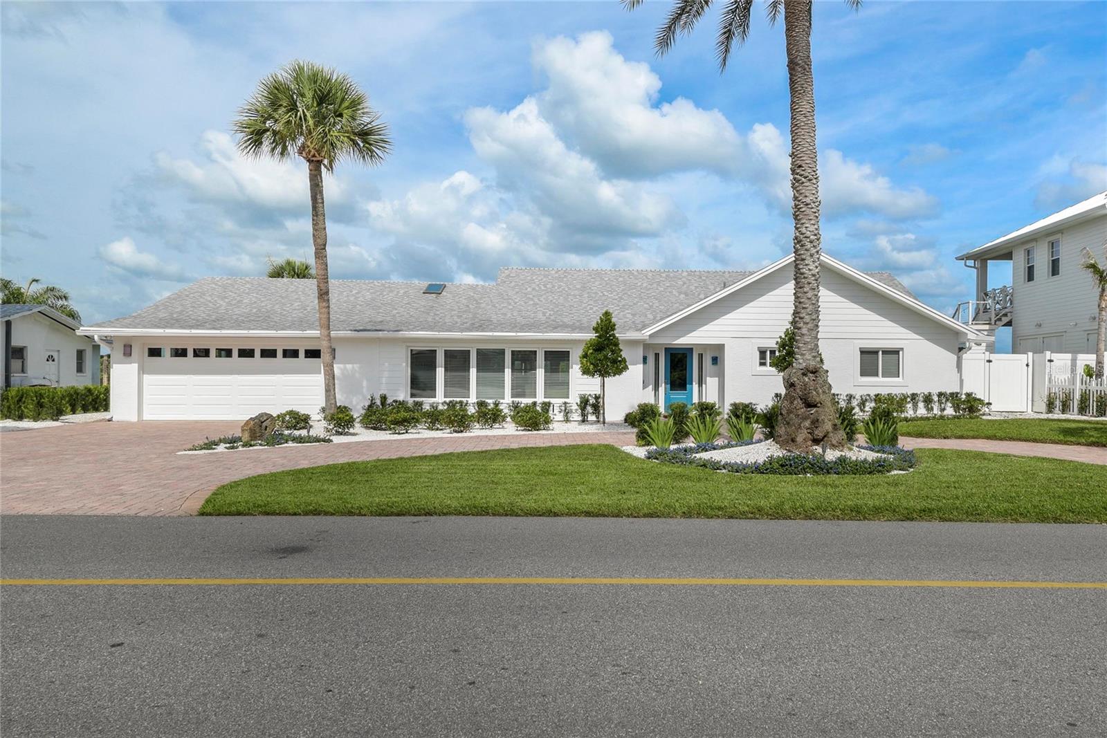 Nestled within the exclusive enclave of Venezia, this exceptional waterfront residence offers a rare blend of privacy, elegance, and refined coastal living. The property enjoys a coveted location that balances a tranquil residential setting with convenient access to the beach, dining, shopping, and recreation.

Thoughtfully designed for both comfortable daily living and effortless entertaining, the home is filled with natural light and features spacious interiors that transition seamlessly to the outdoor living spaces. Expansive glass doors and windows frame the beautifully landscaped grounds while creating a natural connection between the interior and surrounding environment.

The backyard is a private retreat designed to embrace Florida's year-round outdoor lifestyle. A sparkling pool, generous patio areas, and multiple gathering spaces provide the perfect setting for entertaining guests or enjoying quiet evenings at home. Western exposure delivers breathtaking sunset skies, creating a spectacular backdrop for alfresco dining and outdoor relaxation. Complementing the property's waterfront setting, a private boathouse and dock offer convenient boating access while preserving the home's sense of privacy and serenity.

Inside, the well-appointed floor plan offers an inviting blend of sophistication and comfort, with generous living spaces designed to accommodate both intimate gatherings and larger-scale entertaining. Every detail contributes to a lifestyle defined by relaxed luxury and effortless enjoyment.

Rarely does an opportunity arise to own a residence that so seamlessly combines an exclusive neighborhood setting, exceptional outdoor living, private boating amenities, and the timeless appeal of waterfront living. Just minutes from New Smyrna Beach's renowned shoreline, Flagler Avenue, Canal Street, marinas, shopping, and dining, this distinguished Venezia property represents luxury coastal living at its finest.