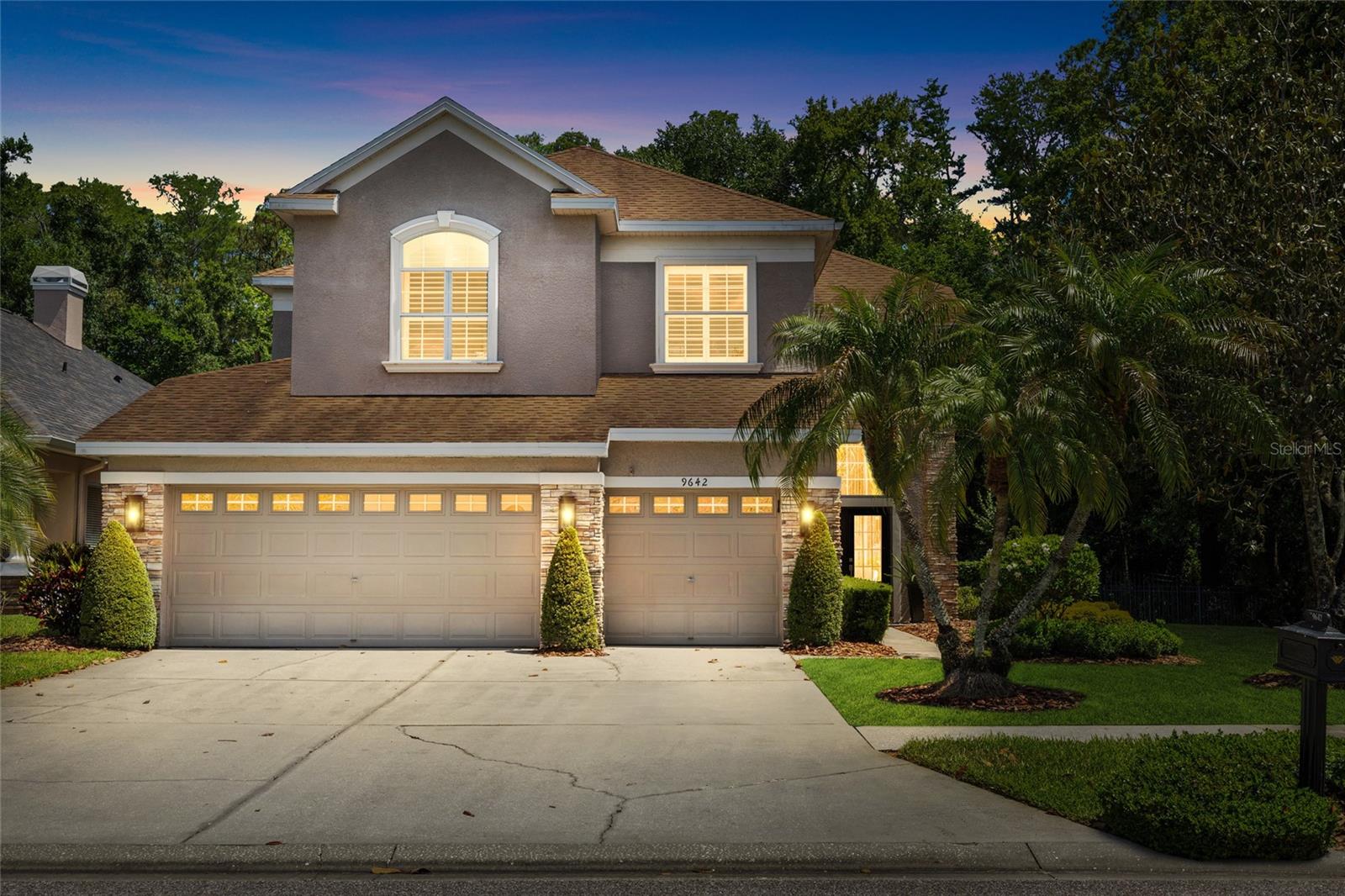 Exquisite Home, Rare Opportunity. Located within the gated Greens of Westchase with 24-hour guard access, this exceptional 4-bedroom, 3-bath pool home is set on a rare 0.26-acre conservation lot with no rear or side neighbors—offering a high level of privacy rarely found in the community. With 2,714 square feet, a 3-car garage, and a thoughtfully designed open floor plan, the home seamlessly blends functional living with high-end upgrades throughout. Interior features include engineered, wide plank white oak hardwood flooring, crown molding, custom millwork, plantation shutters, and detailed wood window casings throughout. The two-story foyer makes a dramatic first impression with striking floor-to-ceiling drapes and designer lighting. The fully remodeled 2025 kitchen is a true centerpiece, featuring a Wolf range, Sub-Zero refrigerator, quartz countertops, upgraded cabinetry, Restoration Hardware hardware, alabaster pendant lighting, and a pot filler. The kitchen flows seamlessly into a spacious dining area, which opens directly to the incredible outdoor living space, while a cozy family room just off the kitchen provides the perfect setting for everyday living. The flexible floor plan includes a first-floor bedroom or office with fiber optic connectivity, ideal for remote work or guests, along with an oversized laundry room with ample storage. Upstairs, the primary suite offers a luxurious retreat complete with a marble fireplace and a fully renovated 2026 spa-inspired bath featuring a freestanding soaking tub, glass-enclosed shower with linear drain, marble flooring and tile, natural wood cabinetry, and designer lighting with fog-resistant mirrors. Also upstairs are two generously sized secondary bedrooms, a full bathroom, and an intimate reading nook—perfect for a quiet retreat or workspace. Outdoor living is designed for entertaining, with a covered patio featuring a tongue and groove wood ceiling and a fully equipped outdoor kitchen with Lynx grill and hood, NatureKast cabinetry, sink, and refrigerator. The heated pool and spa with LED lighting and a paver deck complete the private outdoor oasis. The large, fenced side yard offers additional space for play, pets, or gardening.
Additional highlights include a screened enclosure, mature landscaping, and access to Westchase’s sought-after amenities, including multiple community pools, tennis courts, pickleball courts, parks, playgrounds, walking trails, and top-rated schools.