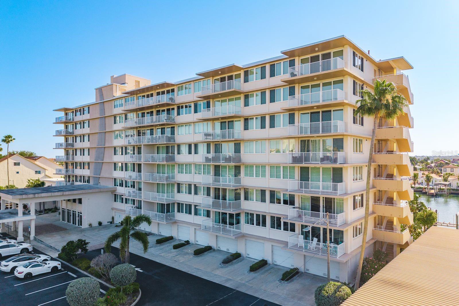 Enjoy resort-style waterfront living in this beautifully updated corner-unit rental in desirable Island Estates. Featuring a rare double-balcony layout, quartz countertops, stainless steel appliances, wood-look tile flooring, updated bathrooms, and an oversized primary suite with a custom walk-in closet. Additional features include a washer and dryer, hurricane-impact windows and doors, updated HVAC, and on-demand hot water. Residents enjoy access to a clubhouse, heated pool, hot tub, fitness center, and potential boat slip availability. Conveniently located just one mile from Clearwater Beach and close to shopping, dining, the Clearwater Marine Aquarium, and the Jolly Trolley. Experience island living with unmatched convenience and coastal charm.