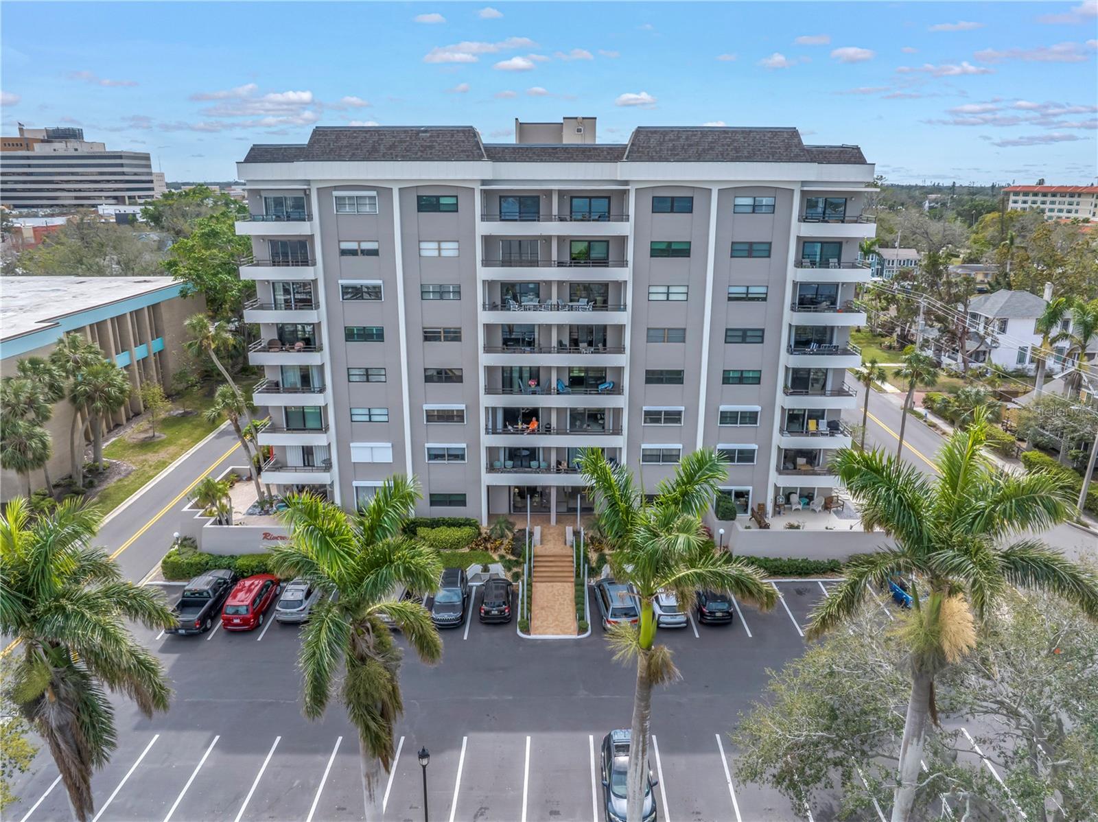If you've ever wanted to live in a condo but can't give up your outdoor space - well this is the CONDO FOR YOU! NEARLY 800 SQ FT of private gated & walled outdoor corner patio with separate gated entrance. Welcome to RIVERVIEW condo - exactly as described this building is perfectly situated on the Manatee River overlooking the yacht basin in downtown Bradenton. The condo building is elevated and LOCATED OUT OF THE FLOOD ZONE - in ZONE X! Rarely offered, only 1 of 4 units in the building with a private gated large outdoor patio. Love to garden? This unit offers multiple planting beds on the patio to customize and enjoy. A foyer entry leads you into the unit where an open living floorplan includes the dining area and living room. Two sets of sliding doors and a wall of windows bring in lots of natural light. The kitchen was renovated in 2019 with white cabinetry, tiled backsplash and appliances. The two bedrooms are separated and both are spacious with walk in closets. An office is tucked into the hallway with built-in desk which can also be converted back to more storage within the unit. The windows in the main bedroom and living area were replaced with hurricane rated Simonton windows. Riverview condo is a 55+ / age restricted building with secure entry, a beautiful community room with a grand piano and gathering room with catering kitchen. The building did not sustain any damage from the 2024 storm season. No flooding, no wind damage nor water intrusion. The unit is being offered furnished, if desired. HVAC replaced 2024, water heater 2017. No pets allowed. Seller for assessments in full for a new elevator (not required for access to this unit), many building renovations recently completed and paid for. Ask for more information.