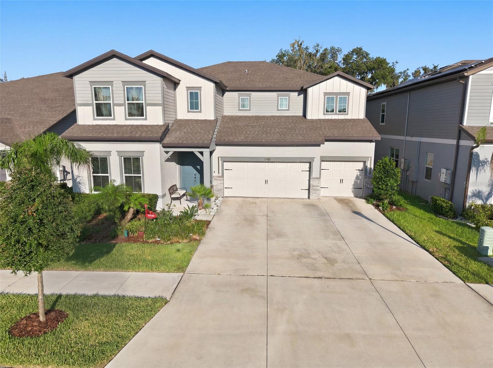 Welcome to Florida living at its finest! This magnificent 5-bedroom, 5-bathroom residence offers 4,281 heated square feet (5,744 total) within the exclusive gated community of Hammock Crest, zoned for top-rated schools.
 Step into an expansive floor plan featuring soaring ceilings and a stunning staircase that sets the tone for this sophisticated home. Tile flooring flows throughout the main level, while plush carpet upstairs adds warmth and comfort. Elegant light fixtures and designer accent walls elevate every room with refined style.
The gourmet kitchen is a true showstopper, anchored by a massive island with seating, a bright breakfast area, and premium appliances. Wine enthusiasts will love the built-in wine refrigerator and wine rack, complemented by a charming coffee bar just off the kitchen and a spacious walk-in pantry. Adjacent to the main living area, a flexible bonus room offers the perfect home office or a private first-floor guest suite.  A hardwired sound system runs throughout the home for seamless entertainment. Upstairs, a large custom laundry room with cabinetry and a stylish backsplash adds everyday convenience. Enjoy true privacy with no rear neighbors and serene green space views from the massive screened lanai an entertainer's dream, complete with a full bathroom and ready for your future pool. Permanent holiday lighting adds year-round curb appeal, and the 3-car garage offers ample space for vehicles and storage.  This exceptional home checks every box for luxury, comfort, and convenience. Schedule your private tour today!