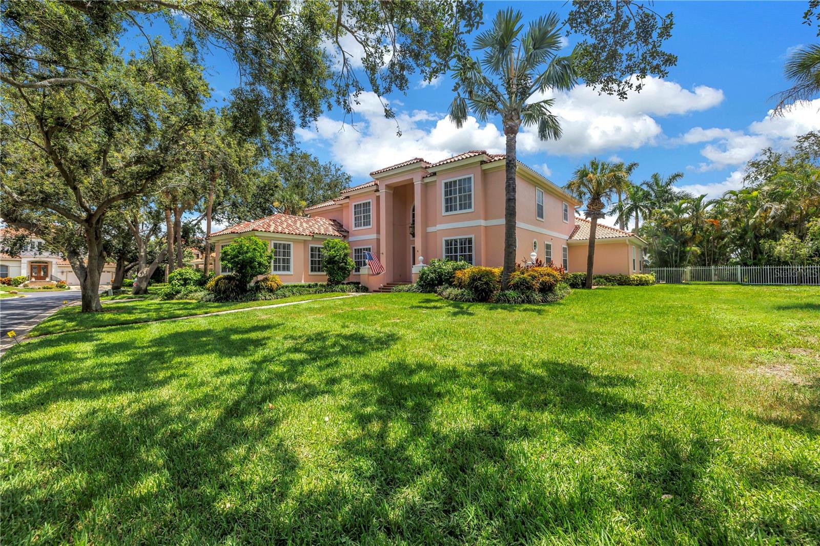 Welcome to 4930 Sandpiper Lane, a stunning estate nestled within the sought-after, gated community of Dolphin Cay in St. Petersburg. This expansive, meticulously maintained home on a beautifully manicured double lot offers the perfect blend of luxury, functionality, and Florida lifestyle. Boasting 6,140 heated sq ft of living space with 6 spacious bedrooms, 4 full bathrooms, and 2 half baths, this home provides ample space for family and guests alike. The thoughtfully designed floor plan includes a dedicated office and an impressive theater room, perfect for working from home or enjoying movie nights in style. Outdoors, the private backyard retreat features a sparkling swimming pool, a basketball court, and lush mature landscaping — ideal for entertaining or simply relaxing under the Florida sun. A detached 3-car garage offers added convenience and storage. Peace of mind updates include a new roof in 2018, and a majority of the AC being replaced in 2024. Dolphin Cay is one of St. Pete’s premier gated waterfront communities, offering amazing sunset views to the West and Gulf of Mexico, an elegant community center with billiard/casino room, library, two community pools (one adult only), three Har-tru lighted tennis courts, private pier, health and fitness center, spa, private grilling area, storage & launch area for kayaks, plus a private 2 acre beach. Dolphin Cay is situated on 88 acres of lushly landscaped property with over 4 miles of boardwalks and nature trails that meander through a 24 acre wildlife preserve and around Spoonbill Lake. The Pinellas Bike Trail runs right in front of this complex and leads to miles of biking & walking trails throughout Pinellas County. All of this within minutes of downtown St. Petersburg, world-class dining, shopping, and the Gulf beaches. This is a rare opportunity to own a truly special property in a secure, amenity-rich neighborhood. Schedule your private showing today and experience the best of coastal living.