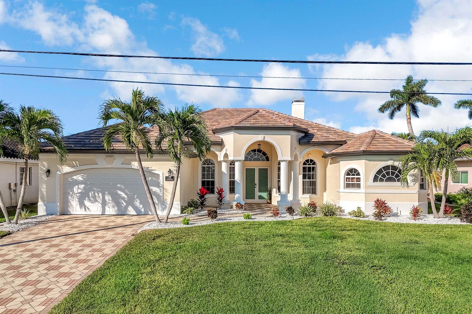 Your Paradise Awaits with this Luxury Gulf Access 4 Bedroom Home. Gorgeous!! NEW IMPACT WINDOWS THROUGHOUT 2026, NEW
POOL/SPA/TRAVERTINE PAVERS, LIGHTING, GARAGE DOOR, CUSTOM CABINETS, BAR, EXTERIOR LANDSCAPING! Updated with top of the line
finishes. Everything in the home screams grandeur. This custom built home offers the best of everything! Freshly painted inside and out.
Boasting just under 3000 square feet with 4 bedrooms, 3 baths and a separate formal dining room, which can also become another bedroom or
den. So many different spaces to enjoy, such as a front living room, back family room with bar, formal dining room, breakfast nook, huge lanai!
Featuring double tray ceilings, arched IMPACT windows, built-in entertainment center, REAL fireplace, large master suite w/walk-in closet,
Jacuzzi tub, walk-in shower and bidet with tumbled marble and travertine stone floors throughout. Professionally designed with all the finishing
touches and stunning upgrades. Open Gourmet Kitchen w/bar seating, granite countertops, custom cabinetry, stainless appliances and wine
fridge. The WESTERN facing lanai and pool area are outdoor living at its best...enjoy the evening sunset from your NEW waterfront lanai with
new custom paver/travertine pool deck, newly resurfaced and redesigned heated pool and spa perfect for relaxing in your own tropical oasis.
Panoramic screen allows for unobstructed views of the water. This is Home! Located in a highly sought area of Southwest Cape Coral, your new
home is convenient to walking and bicycling paths, just blocks away from the popular Cape Harbour area, shops, waterfront dining and
entertainment. Start living the Florida lifestyle today! The Time is Now!! NEW FLAT TILE LUXURY ROOF 2024, NEW AC 2021. Zero hurricane
damage.