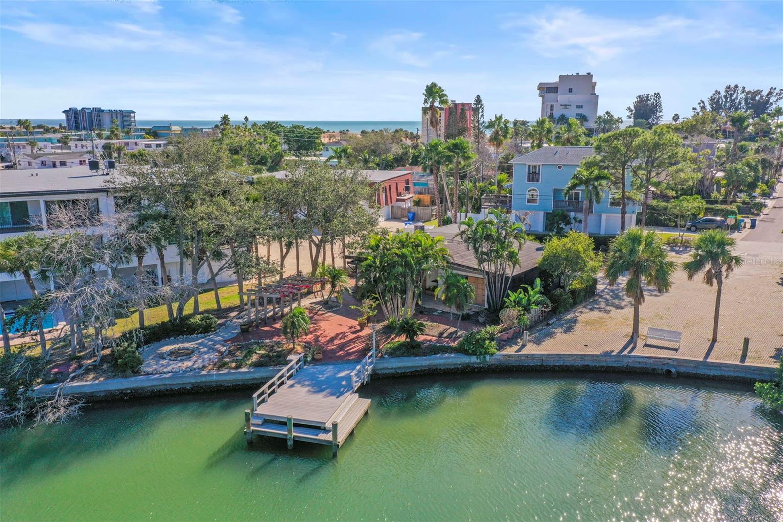 Located in a quiet waterfront neighborhood in Treasure Island, this lot offers protected water access with a short travel distance by boat to the Gulf, and is within close walking distance to public beach access, restaurants, retail, and John’s Pass Village. Zoned RM-15, providing potential redevelopment options for multi-residential or single-family use. Buyers are responsible for their own due diligence to confirm zoning, redevelopment guidelines, FEMA/City requirements, and all measurements. Current home is still in place and has been remediated after flood damage. Home may be able to be restored, but seller makes no warranty as to level of damage.