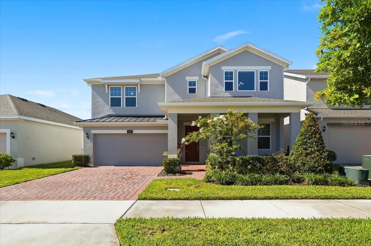 Welcome to this stunning 5-bedroom, 3-bath home built in 2023 by LandSea Homes, featuring the desirable Wilshire floor plan with almost 3,200 square feet of living space. Perfectly positioned on a canal with access to the Kissimmee Chain of Lakes, this home blends modern comfort, flexible living, and the Florida lifestyle buyers are looking for.  From the moment you arrive, the inviting front porch sets the tone. It's the perfect spot to enjoy your morning coffee while watching the neighborhood come to life with walkers, runners, and bike rides. Inside, you'll find a spacious and thoughtful layout designed for both everyday living and entertaining. The main level features a downstairs bedroom and full bath, ideal for guests, multigenerational living, or added privacy, along with a dedicated office for working from home or managing daily life. The open kitchen boasts stainless steel appliances, a large island, and a dining area just off to the side, creating an easy flow for hosting, gathering, and staying connected.  Upstairs, you'll find four additional bedrooms, including a spacious primary suite with a large walk-in shower and generous walk-in closet. A loft and separate flex space provide even more room to spread out, whether you need a media area, playroom, home gym, study space, or second living area.  Step outside to your screened back lanai and enjoy peaceful canal views overlooking the water. The newly finished pool, completed in 2024, creates the ultimate backyard retreat for relaxing, entertaining, and enjoying sunny Florida days. The canal offers the potential for a private dock, giving you the opportunity to further embrace waterfront living and access to the Kissimmee Chain of Lakes.  The community adds even more to love, with a boat lift that provides access from the canal system out to the lake, plus a community pool with a splash area and a playground. Whether you're enjoying time at home, relaxing by your own pool, or taking advantage of the neighborhood amenities, this home offers a lifestyle that feels connected, convenient, and full of opportunity.  With nearly new construction, a flexible floor plan, a new pool, canal frontage, lake chain access, and wonderful community amenities, this home offers space, lifestyle, and location all in one beautiful package.