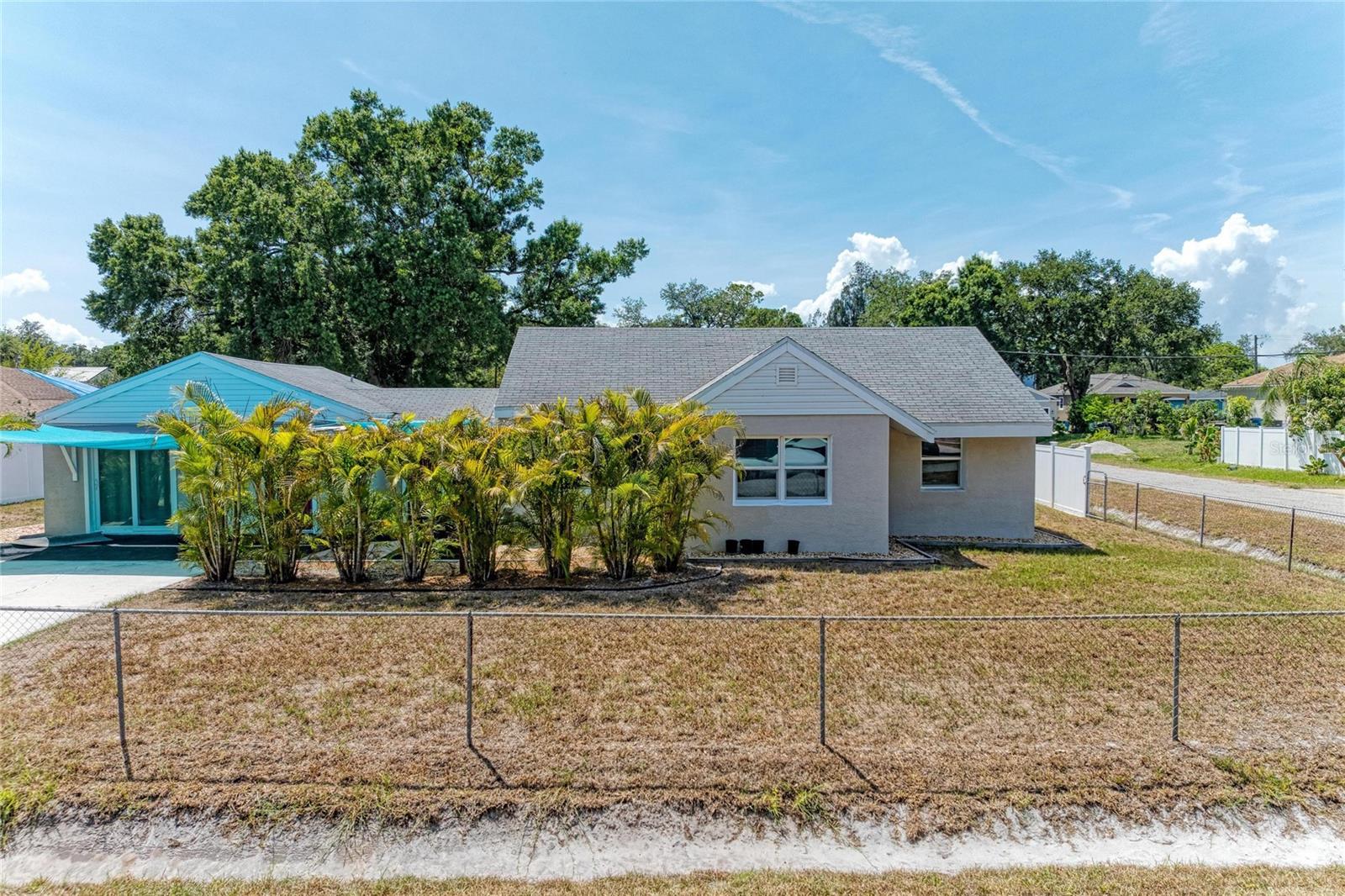 Take a look at this beautiful block home with a separate mother in law suite!  Open floor plan layout in both homes, large slab lanai with custom awnings, located near  the Little Manatee River.  Renovated in 2020 including waterproof Luxury Vinyl Plank flooring in main areas, stainless steel appliances, granite countertops, cabinets, doors, Stucco siding, 2 AC units, washer/dryer and much more!  This home and apartment rest on a valuable double lot in Old Ruskin and are an excellent opportunity as a residence/income producing property in a great location!  Bring your boat, RV, and all your toys- NO HOA or monthly fees!! Corner lot, gated and fenced!  Priced to sell!!