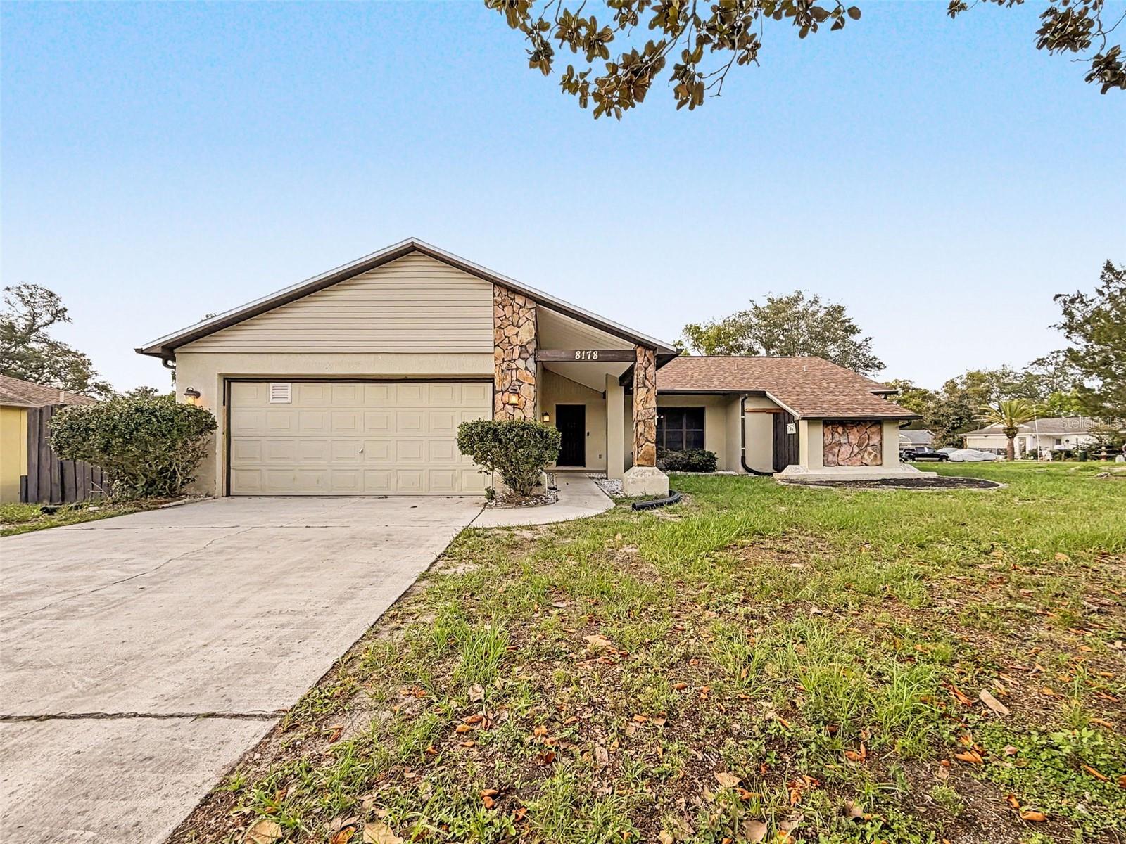 POOL home is in Spring Hill. NO HOA. 2-bedroom, 2-bath home 1225 sq ft of comfortable living space with A/C 2021. Fully remodeled  Bakers kitchen with granite counters. Laminate Tile (waterproof) & wood floors. Master Bath remodeled. Partially fenced yard. Inside Laundry for your convenience. Large corner lot enjoy the view.