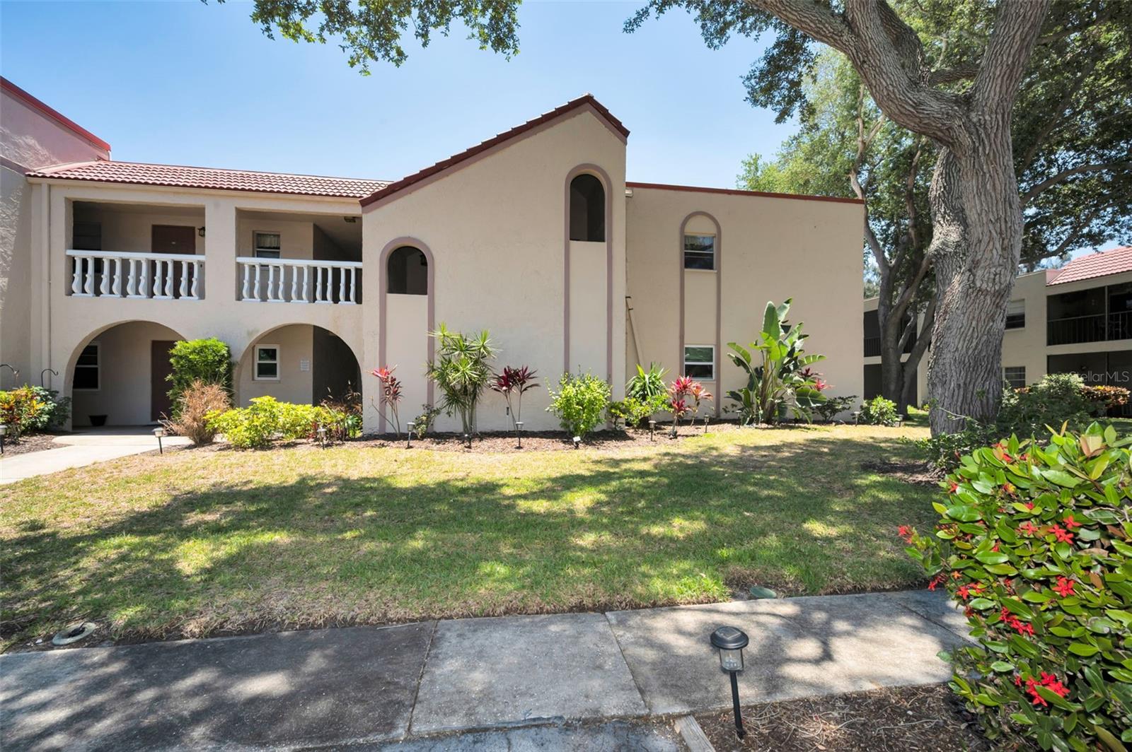 Priced to sell, this spacious corner-unit condo in the desirable Antigua Condominium Community offers an excellent opportunity to make it your own! This 2-bedroom, 2-bath residence features an open-concept living and dining area that flows seamlessly from the kitchen, creating a functional and inviting layout. The spacious living area and bedrooms offer plenty of room to spread out, along with multiple storage spaces throughout. A large storage closet at the unit entry could also serve as a pantry, and a private utility/laundry room is conveniently located just outside the condo.
As a corner unit, the condo is filled with natural light and features a private balcony where you can relax with your morning coffee while overlooking the community amenities.
Antigua residents enjoy access to a community pool, tennis and pickleball courts, fire pit, and a clubhouse featuring table seating, foosball, and ping pong. Ideally located in Seminole, close to shopping, dining, beaches, and everyday conveniences. With cosmetic updates and minor repairs, this condo has incredible potential to become a beautiful full-time residence, seasonal retreat, or investment opportunity.  Water, sewer, cable, and internet are included in the $691.05 per month condo fee.