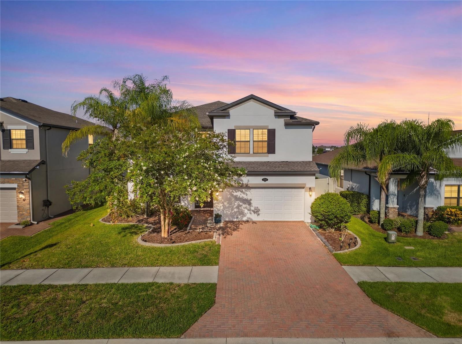 Virtually Staged. Why settle for an ordinary backyard when you can wake up to breathtaking lake views every day? Welcome to this exceptional waterfront home in the highly desirable Long Lake Ranch, where comfort, style, and unforgettable sunsets come together.

Situated on one of the community's largest lakes, this beautifully updated home features 5 bedrooms, 3 full bathrooms, a spacious bonus room, and a 2-car garage. From the moment you step inside, you'll be captivated by stunning water views, abundant natural light, soaring ceilings, elegant finishes, and an open floor plan designed for both everyday living and entertaining.

The chef's kitchen features 42-inch cabinets, granite countertops, stainless steel appliances, double wall ovens, a GE cooktop, a brand-new designer range hood, a spacious breakfast bar, a convenient butler's pantry, and a large walk-in pantry with exceptional storage.

A first-floor bedroom and full bath offer the perfect space for guests, multigenerational living, or a home office. Upstairs, the luxurious owner's suite showcases spectacular lake views, a sitting area, oversized custom walk-in closets, and a spa-inspired bath with dual vanities, a soaking tub, and a separate shower. Three additional bedrooms and a large bonus room provide endless flexibility.

Step outside to your covered lanai and brand-new oversized concrete patio, the perfect place for entertaining, family gatherings, or simply relaxing while enjoying peaceful waterfront views.

Major recent upgrades include brand-new luxury wood flooring throughout, a new roof (March 2025), a designer kitchen hood, plantation shutters, Cat 6 wiring, 5.1 surround sound pre-wire, recessed lighting, and structured wiring with the Guardian System, making this home truly move-in ready.

Long Lake Ranch offers a resort-style pool, fishing dock, 1.5-mile lakeside walking trail, playground, tennis and basketball courts, all conveniently located near the Veterans Expressway, Tampa International Airport, shopping, dining, and top-rated schools.

Homes with this combination of waterfront views, thoughtful upgrades, and move-in-ready condition rarely become available. Schedule your private showing today!