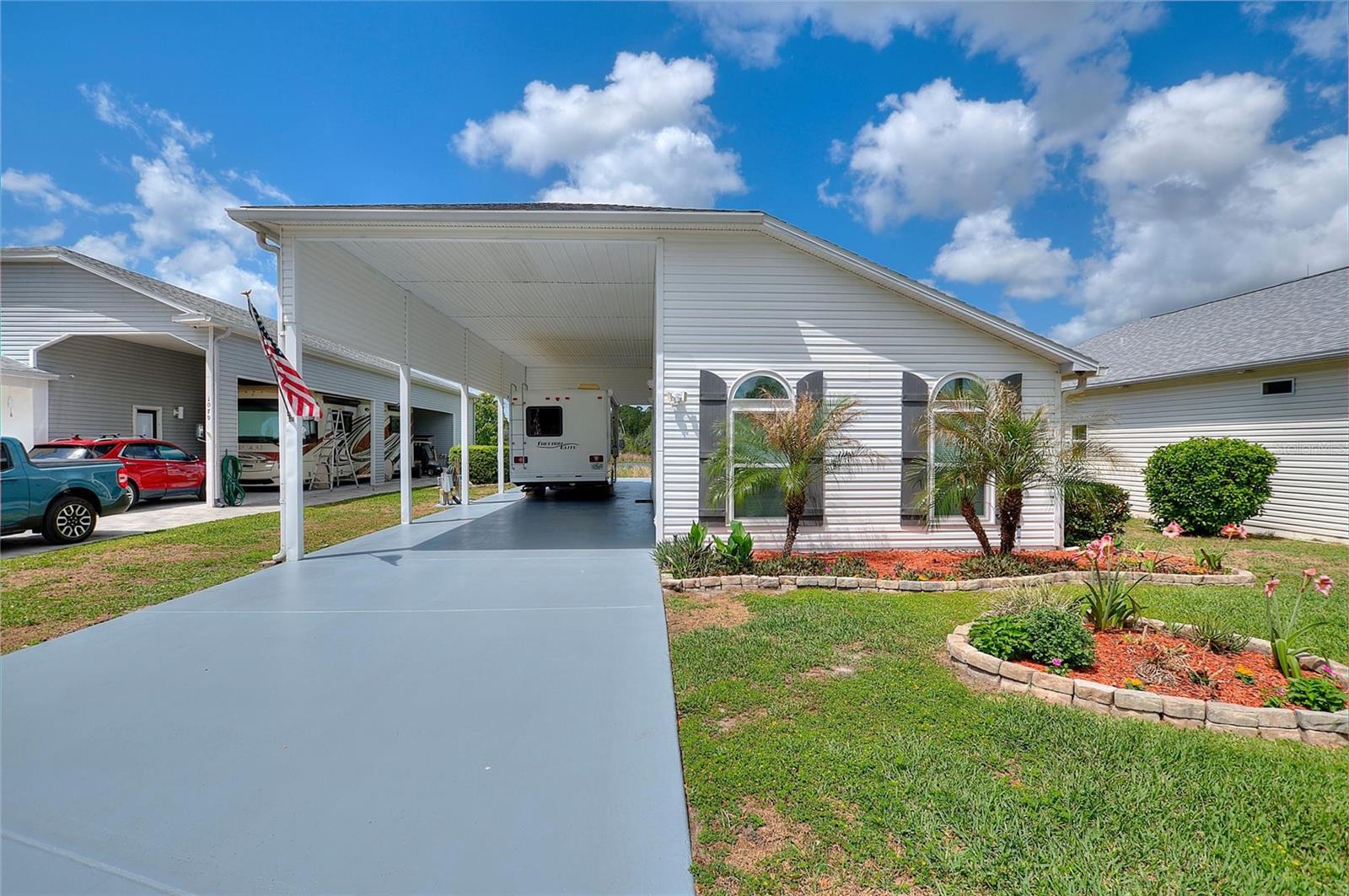 Located in the desirable 55+ community of Mt. Olive Shores North in Polk City, this well-maintained 1-bedroom, 1-bath home offers comfortable living with a scenic lake view. The property is ideal as a seasonal retreat or full-time residence and is situated within a gated community designed for RV enthusiasts. The home features an efficient layout with a bright living space and peaceful water views. The community offers a variety of amenities, including two clubhouses, pools, fitness center, Pickel ball courts, dog park and lots of organized social activities. Conveniently located in Central Florida providing easy access to Orlando, Tampa, shopping, dining and area attractions.