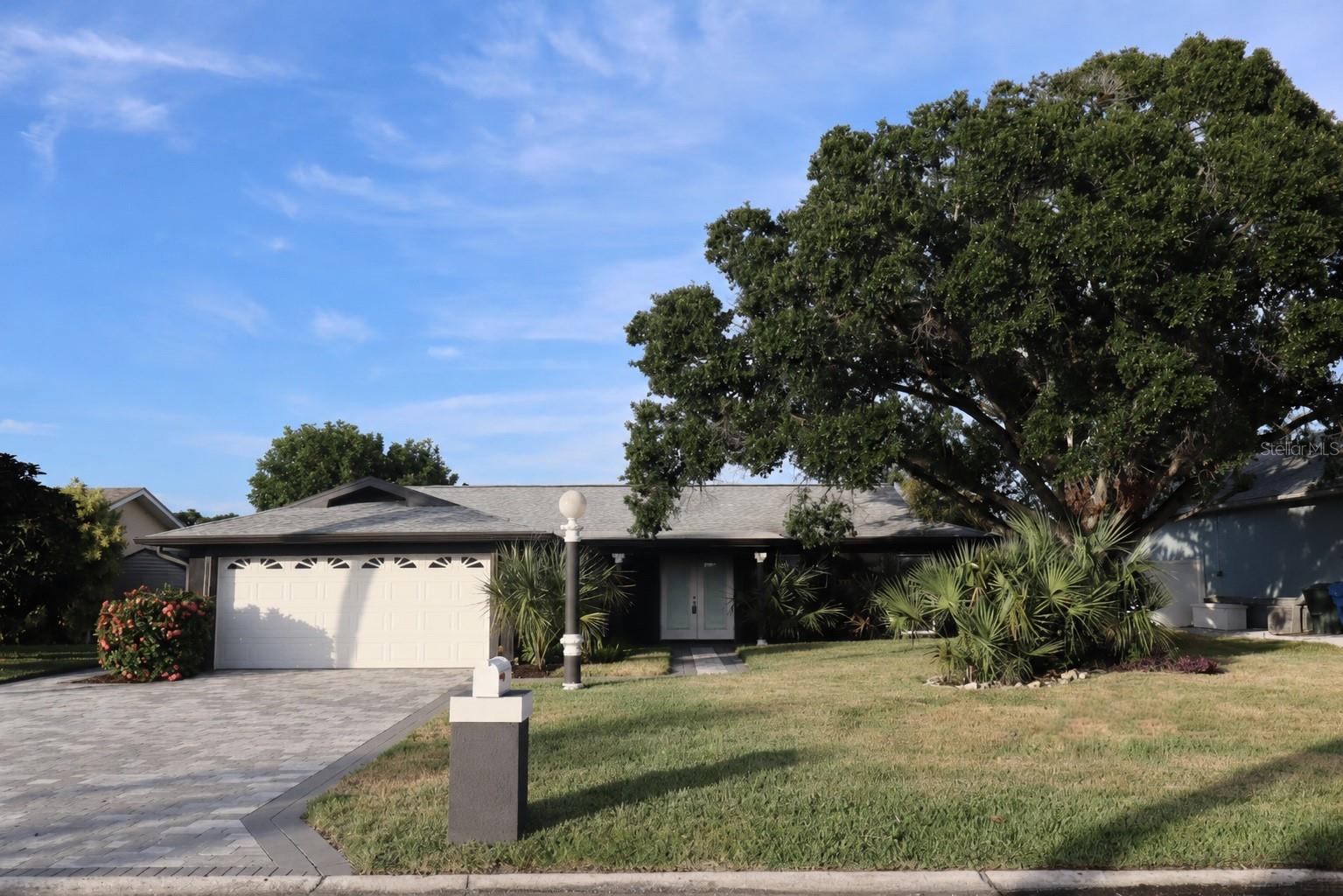 Welcome to your dream waterfront oasis in Apollo Beach! This beautifully updated 3-bedroom, 2-bathroom pool home offers direct, bridge-free access to Tampa Bay from a deep-water canal. Perfect for boaters, the property features a concrete seawall and a 10x10 dock equipped with a 13,000-lb boat lift. Inside, the stunning luxury gourmet kitchen elevates your daily living experience with an open layout and premium stone countertops. The entire home features gorgeous porcelain tile flooring and updated bathrooms. Enjoy ultimate peace of mind with major 2021 capital upgrades, featuring a new roof, exterior stucco, and a 2025 pristine screened-in pool. The outdoor space is an entertainer's paradise, boasting a 3-lane paver driveway, a 10x10 fire pit pad, a storage shed on concrete, and lush St. Augustine grass. NO HOA and NO CDD restrictions! Located just minutes from local marinas, waterfront dining, shopping, and nature preserves. Schedule your private tour today!