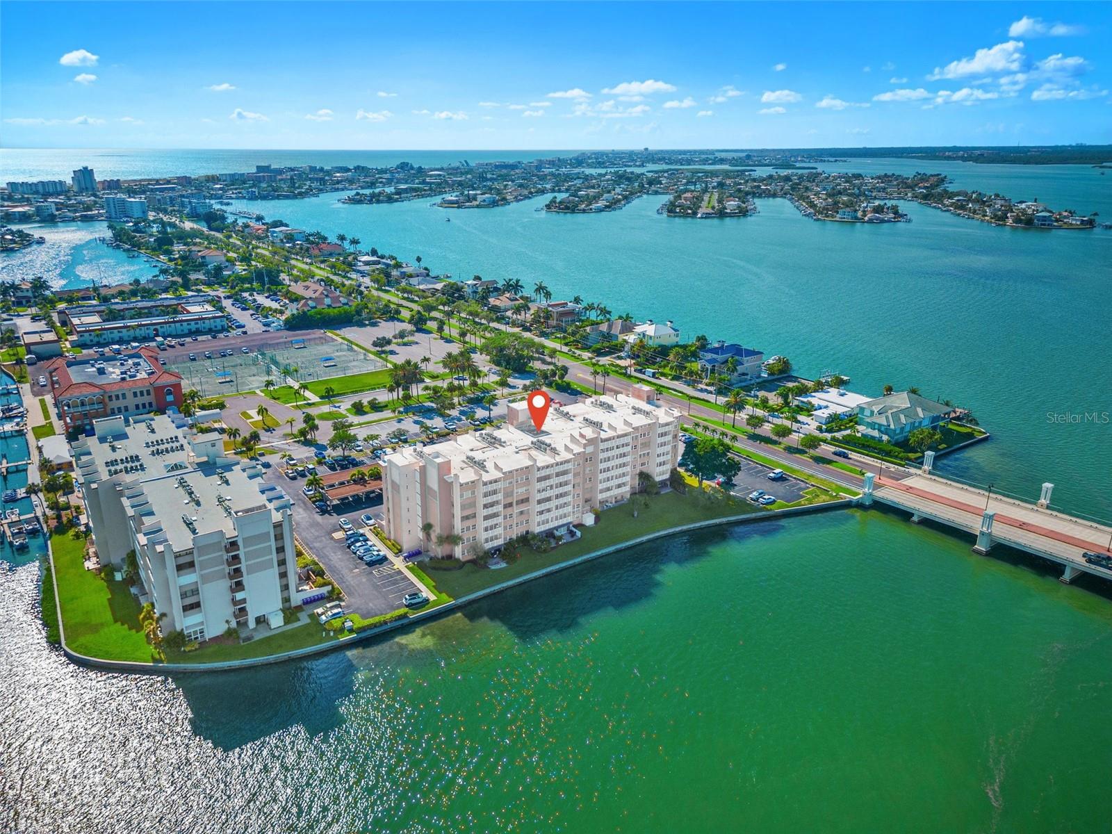 Welcome to luxury waterfront condo living on Boca Ciega Bay with stunning intracoastal waterway views and unforgettable Florida sunrises. This fully updated designer condo features high-end finishes, modern coastal style, and an open concept layout perfect for entertaining and everyday living.

The chef’s kitchen is equipped with premium JennAir appliances, sleek concrete countertops, custom cabinetry, and ambient lighting that creates a warm and inviting atmosphere. The spacious living area flows seamlessly into a cozy sitting space with a built-in bar, ideal for hosting guests or relaxing at home.

Step onto the expansive private balcony and enjoy panoramic water views of Boca Ciega Bay, the Intracoastal Waterway, and the Causeway Bridge—perfect for outdoor dining, morning coffee, or evening sunsets.

This two bedroom, two bathroom condo offers split bedrooms with ensuite baths, generous closet space, and a convenient in-unit laundry room. Additional features include assigned parking and a private storage unit.

Located just minutes from St Pete Beach, this waterfront property provides easy access to beautiful sandy beaches, boating, marinas, waterfront dining, shopping, and downtown St Petersburg. Ideal as a primary residence, vacation home, or investment property, this condo delivers the best of Florida coastal living, waterfront real estate, and maintenance-free lifestyle.

Don’t miss this opportunity to own a move-in ready waterfront condo in one of the most desirable locations near St Pete Beach and Boca Ciega Bay.