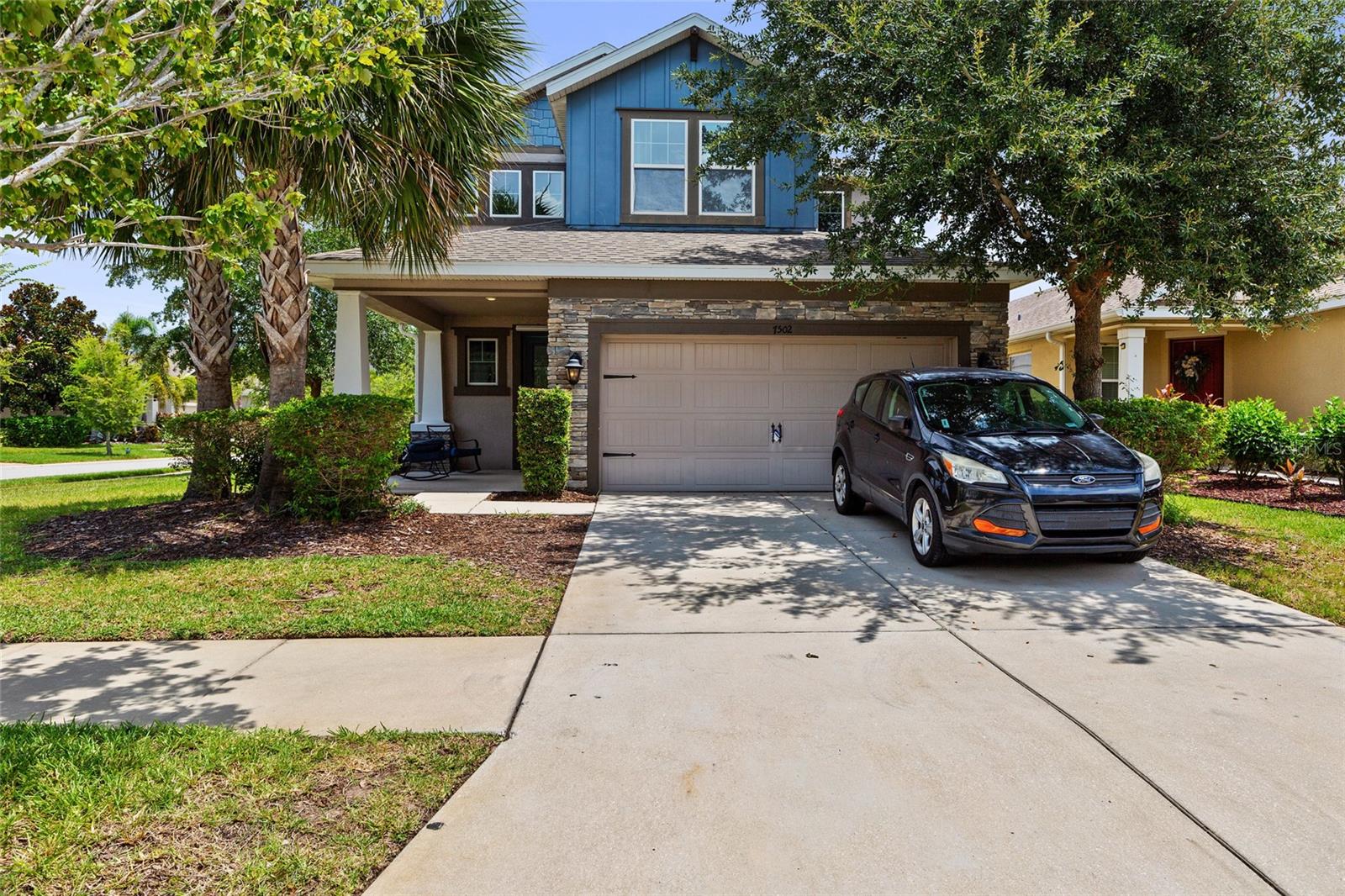 Welcome to this beautifully maintained home in the highly sought-after Waterset community of Apollo Beach! Offering exceptional curb appeal with a charming covered front porch and a spacious screened lanai overlooking the backyard, this home provides the perfect balance of indoor comfort and outdoor Florida living.

The bright, open-concept floor plan is ideal for both everyday living and entertaining, featuring generous living spaces filled with natural light. Whether you're relaxing with your morning coffee on the front porch or hosting family and friends on the screened lanai, you'll appreciate the thoughtful design and inviting atmosphere.

Residents of Waterset enjoy resort-style amenities, including multiple community pools, a fitness center, clubhouse, splash pad, playgrounds, dog parks, scenic lakes, miles of walking and biking trails, tennis, pickleball, and basketball courts. Conveniently located just minutes from I-75 and US-41, you'll enjoy easy access to downtown Tampa, MacDill Air Force Base, Tampa International Airport, St. Joseph's Hospital–South, shopping, dining, marinas, golf courses, and the waterfront. Nearby destinations include Publix, Sprouts Farmers Market, Walmart, Starbucks, Circles Waterfront Restaurant, Finn's Dockside Bar & Grill, the Manatee Viewing Center, Apollo Beach Nature Preserve, and several Gulf Coast beaches. This exceptional home offers the perfect combination of comfort, convenience, and the vibrant Florida lifestyle.