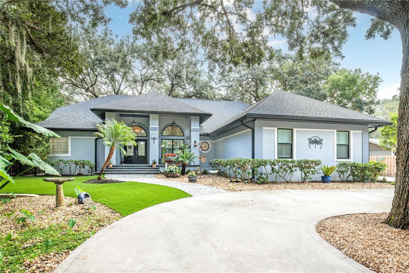 Elegance awaits! If you are looking for a fully updated luxury home near downtown Mount Dora, THIS IS THE HOME YOU NEED TO SEE! Every detail has been thought of and has been renovated extensively in the last 3 years. New doors and windows, roof was redone in 2020, and brand new pool with deck. One of the best features of this home is the the oversized 3 car garage that has volume ceilings, three new garage doors, and attic access for additional storage. Prior owner had car lifts to fit more than 3 vehicles. A car enthusiasts dream! Inside, you'll find a completely updated 4 bedroom and 3.5 bathroom home that is perfect for entertaining. From the moment you enter, you'll feel a sense of warmth, style, and sophistication. Almost every corner of this home has been upgraded. You'll love the updated kitchen with top of the line appliances, a generous sized pantry, and a dry bar for mixing your favorite cocktails or a perfect place for a coffee bar. Plenty of seating for guests at the bar or at a table in the breakfast nook. The primary suite is an owners dream with plenty of space and views of your back yard. It has an updated en-suite bathroom, large walk in closet with built in custom cabinetry, walk in shower, and dual vanities. On the opposite side of the home, your guests will appreciate the Jack and Jill bathroom between two bedrooms. The fourth bedroom also has it's own en-suite bath and there is also a half bath just off the family room. There is new flooring throughout, a formal living room and formal dining room, as well as a large family room with gas fireplace, and a huge inside laundry room. Other features include a central vacuum, built in security (monthly fee applies), plantation shutters and custom window treatments, and crown molding. Perhaps one of the best living spaces is the lanai which overlooks the beautiful back yard with it's large oaks and beautiful mature landscaping. It's a perfect spot for your morning coffee or as a place to unwind at the end of the day with a glass of wine, listening to the birds sing from the shade trees above you. Other features that have been added: you will appreciate having a whole home generator when summer storms knock out power. No need to pay for lawn care and no need to cut the grass in the summer heat as this home has artificial turf, complete with your very own putting green. The landscaping is lush and well maintained and the yard is fully fenced. There is a creek running along the left side of the property and on the opposite side is a Koi pond that is brand new and stocked with fish. The home is plumbed with natural gas and includes a gas line to the lanai for your grill. No more filling propane tanks or running out of gas as you prepare your dinner. The circular drive provides a lot of parking space for visitors to park off the street. This home has it all! The proximity to downtown is great. You will be close enough to enjoy the entertainment and events that happen there, but you are off the main roads so you don't get traffic or passers-by. Your new home sits on a quiet cul-de-sac that is just minutes to everything you need surrounded by awesome neighbors. SELLER IS OFFERING A RATE BUYDOWN OR CLOSING COST ASSISTANCE CREDIT OF UP TO $5K WITH REASONABLE OFFER. Schedule your showng today!