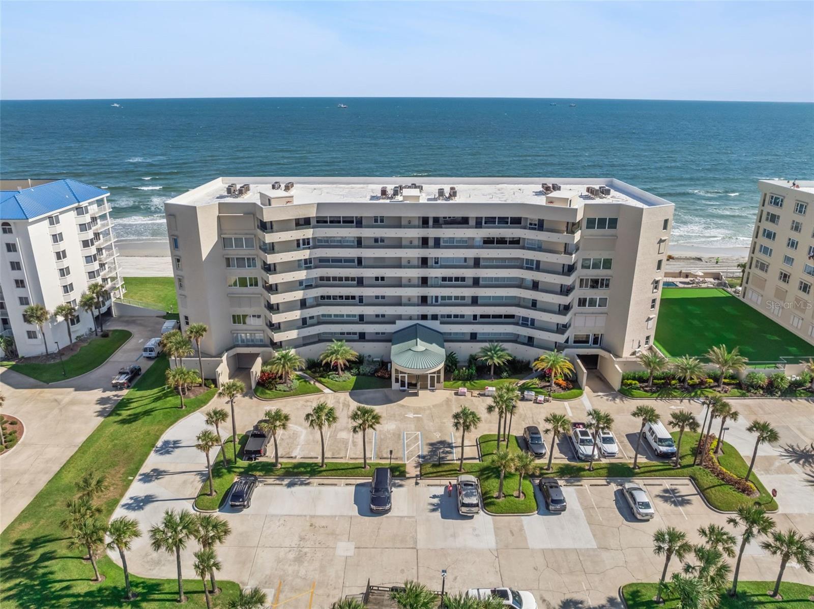 Gorgeous direct oceanfront views from the fifth floor of Tower 8 at The Towers at Ponce Inlet! This furnished, two-bedroom, two-bath residence includes an office nook with built-in bookshelves and an enclosed lanai offering flexible living space, ideal for a den or guest overflow area. Upgrades include a $14,000 HVAC system and upgraded electric storm shutters for added peace of mind. New LVP flooring in family room, kitchen and dining room - just installed May 2026. The kitchen features extended counter space, marble tile, marble backsplash and a spacious breakfast bar, seamlessly flowing into the open family and dining area. Step out onto your private balcony with panoramic ocean views, accessible from the main bedroom and family room, and take in refreshing ocean breezes and breathtaking sunrises over the Atlantic Ocean. The main suite features a garden tub and separate shower, while the guest bedroom is conveniently adjacent to the hall bath. The laundry room has wall cabinets and plenty of storage space for beach gear and easy organization. Residents of Tower 8 enjoy resort-style amenities: a clubhouse, oceanfront pool and spa, fitness center, secure key entry, and underground parking. Pets are welcome (up to two), and short-term rentals are allowed (one-month minimum). Located on the direct oceanfront, No Drive section of the pristine Ponce Inlet beach, this peaceful setting is just moments from the iconic Ponce Inlet Lighthouse, scenic jetty, and dog-friendly beach. Savor coastal dining at local favorites like Down the Hatch and Hidden Treasure Rum Bar & Grill, or explore the 41-acre Ponce Preserve with walking trails, kayaking, fishing, and natural Old Florida beauty. Close to championship golf at LPGA International and Cypress Head, and only a short drive to Daytona International Speedway, this residence perfectly blends luxury, leisure and location. Welcome to your oceanfront oasis!