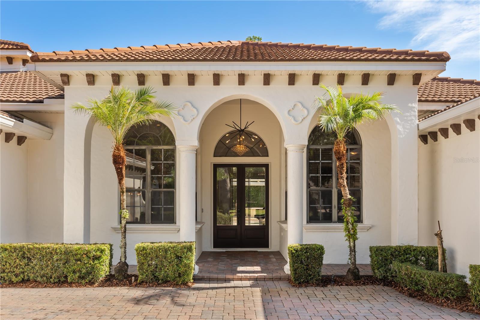 Located within the guard gated community of Reserve at Lake Sound in Windermere, this beautifull 5-bedroom, 5-bath residence offers the perfect blend of elegance, comfort, and functionality. Featuring nearly 3,900 square feet of living space, the home showcases tall ceilings, travertine flooring throughout the main living areas, and thoughtful modern updates completed in recent years.

A grand double-door entry opens to formal living and dining spaces highlighted by contemporary accent walls and a striking fireplace. The spacious kitchen is designed for both everyday living and entertaining, featuring upgraded stainless steel appliances, abundant cabinetry, stylish countertops, a beverage refrigerator, and an open flow into the family room.

The split-bedroom floor plan includes a private office and a spacious primary suite complete with California closets and a luxurious ensuite bath featuring dual vanities, a walk-in shower, and a freestanding soaking tub. Upstairs, the oversized bonus room with full bath offers flexibility as a guest suite, second primary suite, or media room.

Sliding doors lead to an expansive screened pool area ideal for relaxing or entertaining, while the lush backyard garden creates a peaceful setting to enjoy your morning coffee. The home also features a spacious 3-car garage. *Roof and water heater was replaced 5 years ago.*

Ideally located near top-rated schools, shopping, dining, and area attractions, this move-in ready Windermere home is one you won’t want to miss.