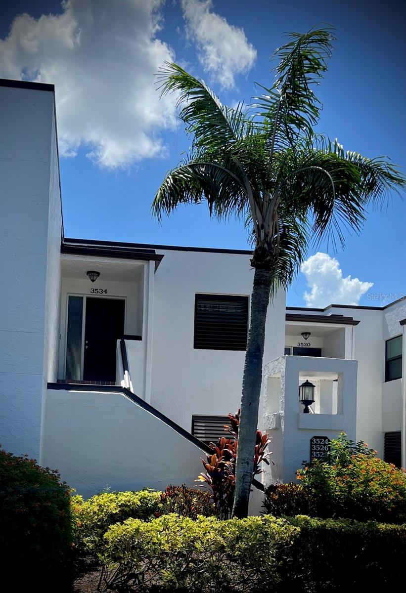 Spacious and beautifully updated 3-bedroom, 2 bath condominium overlooking the 16th fairway with stunning views of the golf course and tranquil waterway.  Enjoy the scenery year-round from the open lanai featuring sliding glass enclosures.  This bright and inviting home offers generously sized rooms, a large walk-in closet, and abundant storage space throughout.  Additional features include covered carport parking with a private storage closet, plus ample guest parking.  Residents can relax at the heated community pool, which overlooks the golf course and waterway, providing a peaceful resort-like setting.  Located in the highly desirable Meadows Community, this beautiful golf community features two championship golf courses, miles of scenic lakes and nature preserves, and over 13 miles of walking and biking trails. Residents also enjoy convenient access to dining, shopping, and a variety of recreational amenities.  Move-in ready and available now ---don't miss this opportunity to enjoy the Florida lifestyle at its finest!!!!!!!!