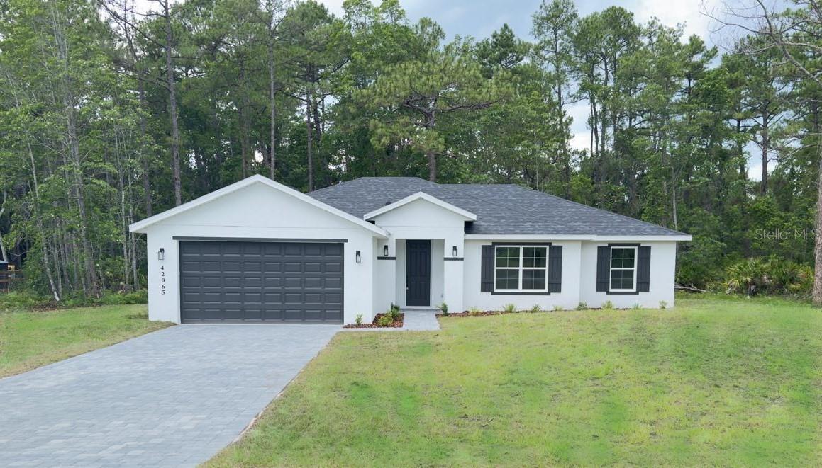 Discover the perfect combination of modern design, privacy, and country charm in this brand-new home located on a beautiful 1-acre homesite in the sought-after Royal Trails community. Designed for comfortable living, this 4-bedroom, 2-bath residence features an inviting open floor plan, ideal for both everyday life and entertaining. The spacious kitchen offers contemporary finishes and flows effortlessly into the main living area, while waterproof luxury vinyl flooring throughout the primary living spaces provides both elegance and easy maintenance.
One of the property's standout features is its exceptional setting, backing to approximately 78 acres of state-owned land, creating a peaceful natural backdrop with no rear neighbors and outstanding privacy.

Royal Trails is an RV-friendly community offering deeded access to Lake Norris, along with a community park, playground, pavilion, and approximately 26 miles of scenic roads perfect for walking or biking. Residents also enjoy zoning that allows up to two horses pr acre and permits RV or motorhome parking after the home is completed.
Although surrounded by the beauty of the Ocala National Forest and Seminole State Forest, the community remains conveniently located near Eustis, Mount Dora, DeLand, and Lake Mary, with quick access to the Wekiva Parkway and SR-429. Orlando's world-famous attractions, Atlantic beaches, and both Orlando and Daytona International Airports are all within approximately one hour.
If you're looking for a newly built home that offers acreage, privacy, and the freedom of country living without sacrificing convenience, this Royal Trails property is an outstanding opportunity. Schedule your private showing today.