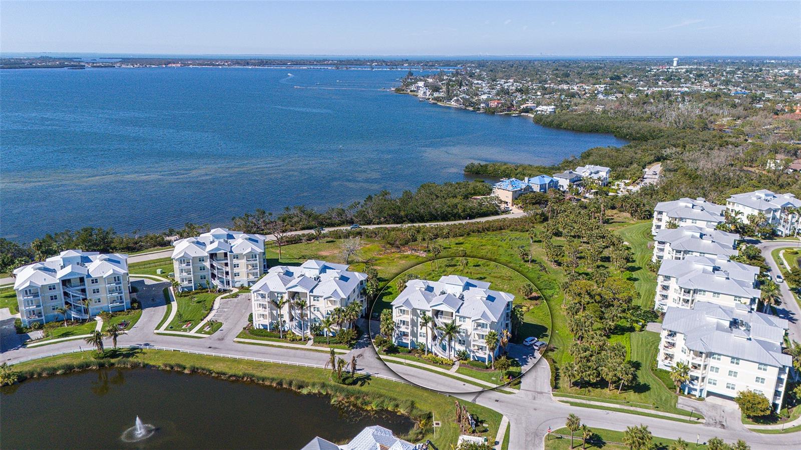 Welcome home to coastal living! Live like you’re on vacation in the gated, Key West-style resort community of Palma Sola Bay Club. Three bedrooms, two full baths, and one half bath with 1857 square feet of living space. Built in 2020. Upgrades throughout include French doors to your private balcony in the living room and primary bedroom, high ceilings, crown molding, granite countertops and solid wood cabinets in kitchen and baths. A breakfast island is featured in this beautiful kitchen. The owner's suite has a large walk-in closet and French doors opening out to the private balcony. The bath features dual vanities, soaking tub and standalone shower. The guest bedroom has an adjacent bath for your guests. The home features a third spacious bedroom. The half bath is large and conveniently in the hallway, easily accessible from the main living area. The dining room living room combination is spacious with plenty of windows to let in the light. Two assigned under-building parking spaces are conveniently near the elevator. Palma Sola Bay Club is just off beautiful Palma Sola Bay in West Bradenton, minutes from the sandy beaches of the Gulf to the west, the culture, fine dining, entertainment and golf courses to the east. Within the community, there are 30 acres of protected preservation land, two charming lakes, tropical resort landscaping, a dog park and an observation deck with kayak launch with stunning views of Palma Sola Bay. The two-story clubhouse in the heart of the community boasts a fitness center, billiards table, social room and two kitchens for entertainment. Outside, enjoy a heated pool with an expanded deck for lounging, fire pit, bocce court, and outdoor entertainment space complete with a wet bar and gas grill. Also, enjoy regular social events, including barbecues, holiday parties and casual get-togethers at our clubhouse, thereby fostering a warm and close-knit atmosphere. Flood insurance included in HOA fees. See for yourself what makes Palma Sola Bay Club an award-winning community year after year.