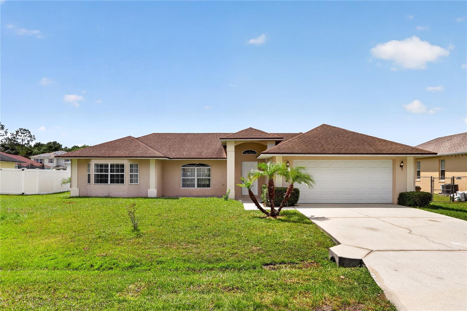 Welcome to this charming 3 Bedrooms, 2 Bathrooms with 2 car garage single family home, nestled in the desirable community of Poinciana Villages in Kissimmee, FL. This well designed and freshly painted 1,887 sq ft single-family residence, features: upgraded tile in the bathrooms, new luxury vinyl flooring in the bedrooms, and a welcoming dining room that flows seamlessly into the open layout. The functional split floor plan highlights an open living and dining area filled with natural light, perfect for relaxing or entertaining family and friends. The spacious layout offers plenty of flexibility, with four comfortable bedrooms which can easily accommodate family, guests, or even a home office. Step outside to your own private backyard, ideal for enjoying sunny Florida days, unwinding on the weekends, or hosting gatherings. Located in Poinciana Villages, you'll enjoy a peaceful neighborhood setting while still being just a short drive
to major attractions like Walt Disney World, as well as nearby restaurants, shopping, and everyday conveniences. Whether you're looking for a primary residence, a vacation getaway, or an investment property, this home offers the perfect combination of comfort, privacy, and a
prime Central Florida location. Make your appointment today !