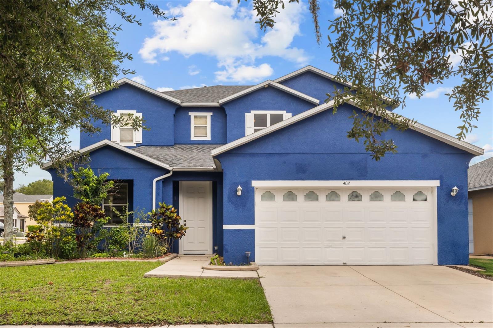 Discover a home designed for comfort, flexibility, and everyday living in Ruskin, Florida. Positioned on a corner lot, this residence offers a thoughtful layout with spaces that adapt to the way you live. The kitchen serves as the heart of the home, featuring ample cabinetry, generous workspace, and a view of the backyard that keeps you connected to the outdoor space while preparing meals or entertaining. The main-level primary suite provides convenience and privacy, creating a comfortable retreat at the end of the day. Upstairs, four additional bedrooms offer flexibility for guests, hobbies, work-from-home needs, or additional living arrangements. Enjoy added peace of mind with a new roof completed in 2025, providing a valuable recent improvement for the home's next owner. With room to spread out and a layout designed for both gathering and personal space, this home provides the opportunity to create a lifestyle that feels uniquely yours. Located with convenient access to Tampa Bay area amenities, outdoor recreation, dining, shopping, and entertainment, this property offers a balance of residential comfort and everyday accessibility.