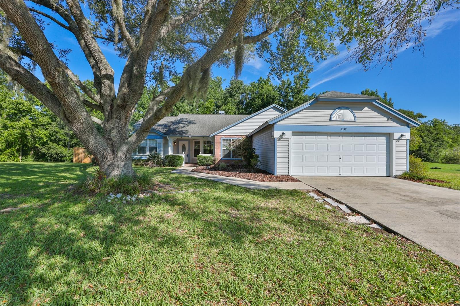 Welcome to the beautiful Walden Lake community!

Nestled on a quiet cul-de-sac, this charming storybook home offers comfort, character, and plenty of space to enjoy. Featuring 1,910 square feet, this split floor plan includes 4 bedrooms and 2 bathrooms, providing ample room for both everyday living and entertaining.

Recent updates include newer windows in all bedrooms, the guest bathroom, and the primary bedroom's main window. The kitchen features newer appliances, and the home also includes a washer and dryer for added convenience. Enjoy your morning coffee/tea on the covered front porch or unwind in the screened lanai overlooking the spacious conservation backyard, offering privacy and peaceful views of nature. Whether you're grilling, entertaining, or simply relaxing, this outdoor space is ready to be enjoyed.

Your new adventure begins right outside your door. Walden Lake offers an exceptional lifestyle with walking trails, playgrounds, dog parks, a sports complex, and community events throughout the year. There truly is something for everyone to enjoy.