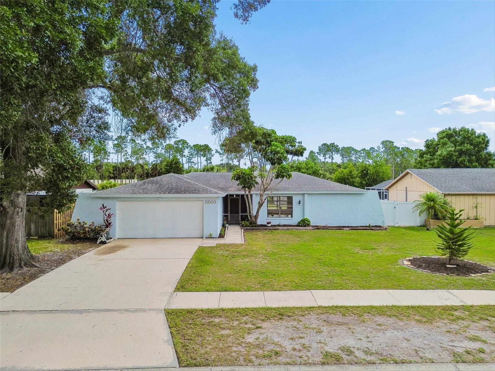 Welcome to this Sugarwood Grove home featuring 3-bedrooms, 2-baths and a 2-car garage situated on a private, fenced lot over looking a pond with no rear neighbors.  As you approach the home you will notice the fresh landscape that greets you to your screened front patio and double-entry doors.  Once you are inside the home you will find an abundance of natural light streaming through oversized windows throughout the home. The spacious floor plan features a formal living room with a cozy fireplace, a dedicated family room, and a dining area designed for both everyday living and entertaining. Your chef's kitchen is situated between both main living areas with views of your outdoor entertaining space making it the perfect kitchen to create memories.  You will love the thoughtfully designed split floor plan that provides your guest privacy, utilizing a designated hallway for  the secondary bedrooms and bath.  You will love the oversized primary suite that will be your relaxing retreat, complete with a walk-in closet and private en-suite bathroom. Your home offers double glass doors that open from the main living area to your expansive patio, creating seamless indoor-outdoor living. Your home's patio features a sink and counter space for gardening or grilling, and a convenient pass-through window connecting directly to your kitchen and perfect for entertaining your family and friends without skipping a beat.  You will appreciate the fully fenced backyard where your peaceful lot provides exceptional privacy and offers endless possibilities to create your own backyard oasis. You will have plenty of room for your future pool, garden, play area, or firepit. Your home offers a convenient location and was recently professionally pressure washed and professionally deep cleaned inside your entire home including the carpets making it ready for your enjoyment.