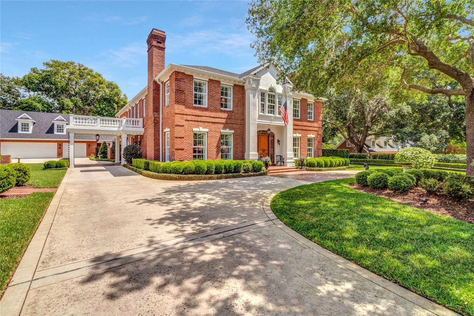 Auction Property. AUCTION LIVE BIDDING OPEN: Bidding ends February 21st. Previously Listed $3.7M. Current High Bid $3M. No Reserve. 

Come home to your private estate in historic Olde Winter Park. Down a private lane, this Charleston-style residence offers the ultimate in privacy. The wrought-iron details and millwork mingle with luxurious finishes such as Brazilian hardwood, marble, and state-of-the-art home technology and upgrades. A top-of-the-line chef's kitchen with double Gaggenau ovens and butler's pantry anchor any gathering, while your formal dining room offers enough space to seat over a dozen friends and family. Enjoy your private owner's wing with two spa-worthy bathrooms and a laundry room. Guests benefit from a secluded retreat in the carriage house apartment, graced with a dedicated entrance. There's considered space for every mood, from the casual keeping room to the formal living room to the covered porch overlooking the tropical pool and fountain. There's even a cozy sunlit space off the library perfect for an additional office, reading nook, or yoga studio.