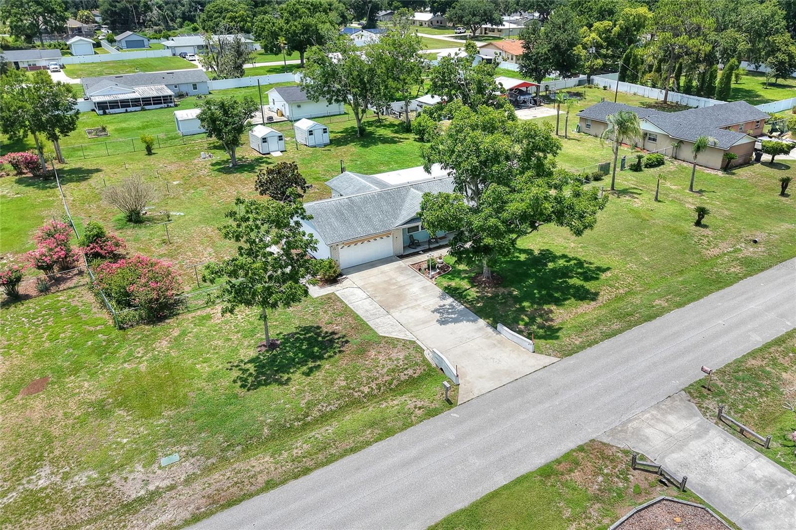 Welcome to 6739 Farris Drive in desirable South Lakeland! This well-maintained concrete block home sits on an impressive 0.65-acre lot with no HOA, giving you extra space, flexibility, and freedom to enjoy your property your way. Located in an established South Lakeland neighborhood and within minutes from the LAKELAND AIRPORT, this home offers convenient access to shopping, dining, area schools, and major routes connecting you to both Tampa and Orlando. Inside, you’ll find a comfortable and functional layout featuring a spacious kitchen with abundant wood cabinetry, along with separate living and dining areas that provide plenty of room for everyday living and entertaining. One of the standout features of this property is the whole-house Generac generator with large-capacity propane tanks, providing peace of mind and the ability to power the entire home during outages. The fully fenced backyard offers exceptional outdoor space and includes two large storage sheds with electricity, perfect for tools, hobbies, equipment, or additional workspace.

You’ll also love the oversized 31 x 15 enclosed rear porch with vinyl windows, creating a wonderful year-round space to relax, entertain guests, or simply enjoy views of the large backyard. The garage is equipped with a retractable awning and screen, adding even more usable living and gathering space.  Move-in ready and packed with practical upgrades, this South Lakeland home offers the rare combination of location, land, no HOA, storage, and peace-of-mind features. Well-priced homes on large lots in South Lakeland are hard to find—schedule your private showing today before this one is gone!