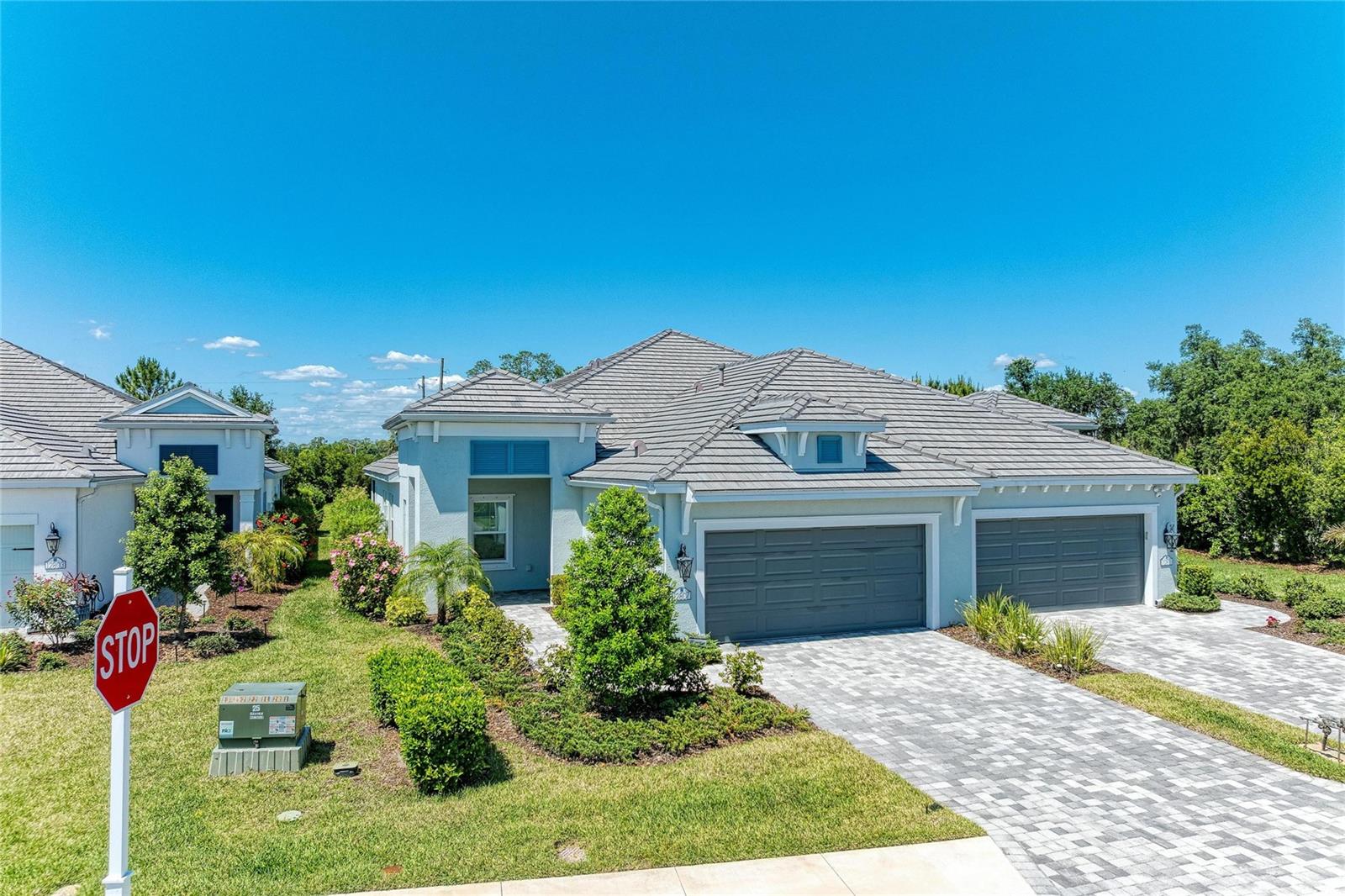 One or more photo(s) has been virtually staged. Welcome to Indigo in Bradenton, Florida! Built in 2023 by Neal Communities, this
beautifully maintained Sandcastle villa offers 3 bedrooms, 2 baths, plus a versatile den/flex
room with 1,832 sq ft under air (2,596 total). Ideally positioned facing a peaceful preserve,
the screened lanai provides a private setting to relax and enjoy Florida living.
The open-concept design features maple cabinetry with upgraded 42" uppers, undercabinet lighting, roll-out shelving, stainless steel appliances, and dimmer lighting in main living areas. The spacious primary suite includes an impressive 11x6 walk-in closet with
added shelving. Additional highlights include ceiling fans with lights throughout, an interior
laundry with a washer and dryer included, abundant storage, and a 2-car garage with extra driveway parking.
Upgrades include range and dryer outlet conversions (electric or gas), home security
system, Levolor S-shaped vertical blinds, and a screened lanai.
Indigo offers a vibrant lifestyle with a private villa, pool, and outdoor kitchen, plus a main
clubhouse featuring a café, kitchen, resort-style pool and spa, fitness center, and pickleball
courts, and a full-time activities director coordinating social events and classes.
Conveniently located near beaches, golf, shopping, dining, schools, and more.
Ideal for full-time living or a seasonal retreat.