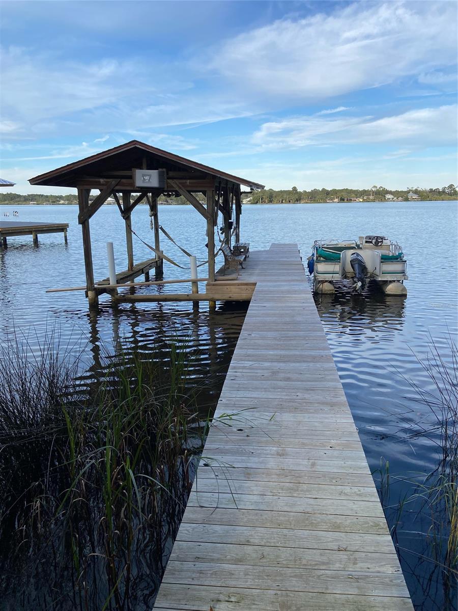 Direct Bayfront home, 3 bed 2 bath ranch style with 1812 sq ft of living space. Large living area, beautiful real hardwood floors, split plan, cathedral type ceilings, large windows overlooking bay, extra deep garage, deep lot, beautiful Bayfront home on dead end street in New Smyrna Beach. ;Water: City