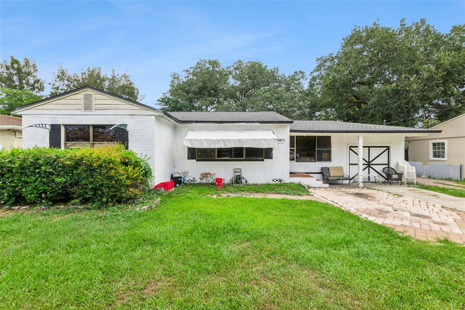 Welcome to 1411 35th Street, an exceptional income-producing property offering versatility, immediate cash flow, and outstanding future potential in the heart of Orlando. Situated on an oversized lot with no HOA, this unique property features a 3-bedroom, 2-bath main home, a detached 1-bedroom, 1-bath studio, and two additional income-producing trailer spaces, one of which is included in the sale. Currently generating approximately $3,750 every month in gross rental income with month-to-month tenants, it presents an outstanding opportunity for investors seeking immediate returns, while also offering flexibility for owner-occupants, multi-generational living, or future redevelopment. There is even potential to add a fifth bedroom, creating even greater value. The main home offers multiple living areas, generously sized bedrooms, updated kitchen cabinetry, renovated bathrooms, durable flooring throughout most of the home, and a covered rear patio perfect for relaxing or entertaining. The oversized lot provides abundant parking with room for boats, trailers, RVs, work vehicles, or future outdoor improvements. Major updates include a roof approximately one year old and an air conditioning system approximately four years old, providing added peace of mind.

Ideally located just minutes from Downtown Orlando, SODO, The Mall at Millenia, Florida Mall, Camping World Stadium, Kia Center, and Orlando International Airport, this property places Central Florida's best destinations within easy reach. Enjoy convenient access to Universal Orlando Resort, Walt Disney World, SeaWorld Orlando, International Drive, and countless shopping, dining, and entertainment options. Nearby everyday conveniences include Publix, Walmart Supercenter, Costco, Target, Lowe's, Home Depot, Chick-fil-A, Chipotle, Miller's Ale House, Olive Garden, and numerous local restaurants. Orlando Health Regional Medical Center, AdventHealth Orlando, and Arnold Palmer Hospital are all just a short drive away. With quick access to Interstate 4, the Florida Turnpike, State Road 408, and John Young Parkway, commuting throughout Central Florida is simple and convenient. Whether you're searching for a high-performing investment, a primary residence with built-in income potential, or a property with room to grow, 1411 35th Street offers a rare combination of location, flexibility, and opportunity that is difficult to find.