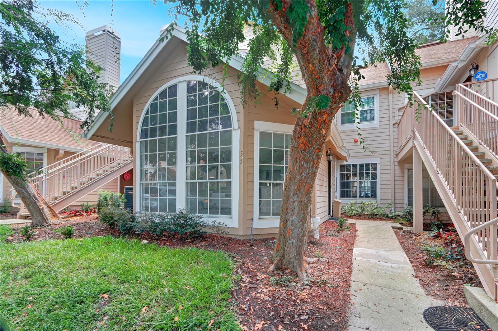 Welcome home to Hidden Springs! This ground-floor 2-bedroom, 2-bath condo features vaulted ceilings, a spacious open floor plan, a cozy wood-burning fireplace, oversized arched windows, and a screened porch. The kitchen offers ample cabinet space and a breakfast bar, and an in-unit washer and dryer. Enjoy resort-style amenities including two pools, a hot tub, fitness center, and tennis courts. Conveniently located near Uptown Altamonte, Cranes Roost Park, shopping, dining, and I-4. Move-in ready and waiting for its next owner!