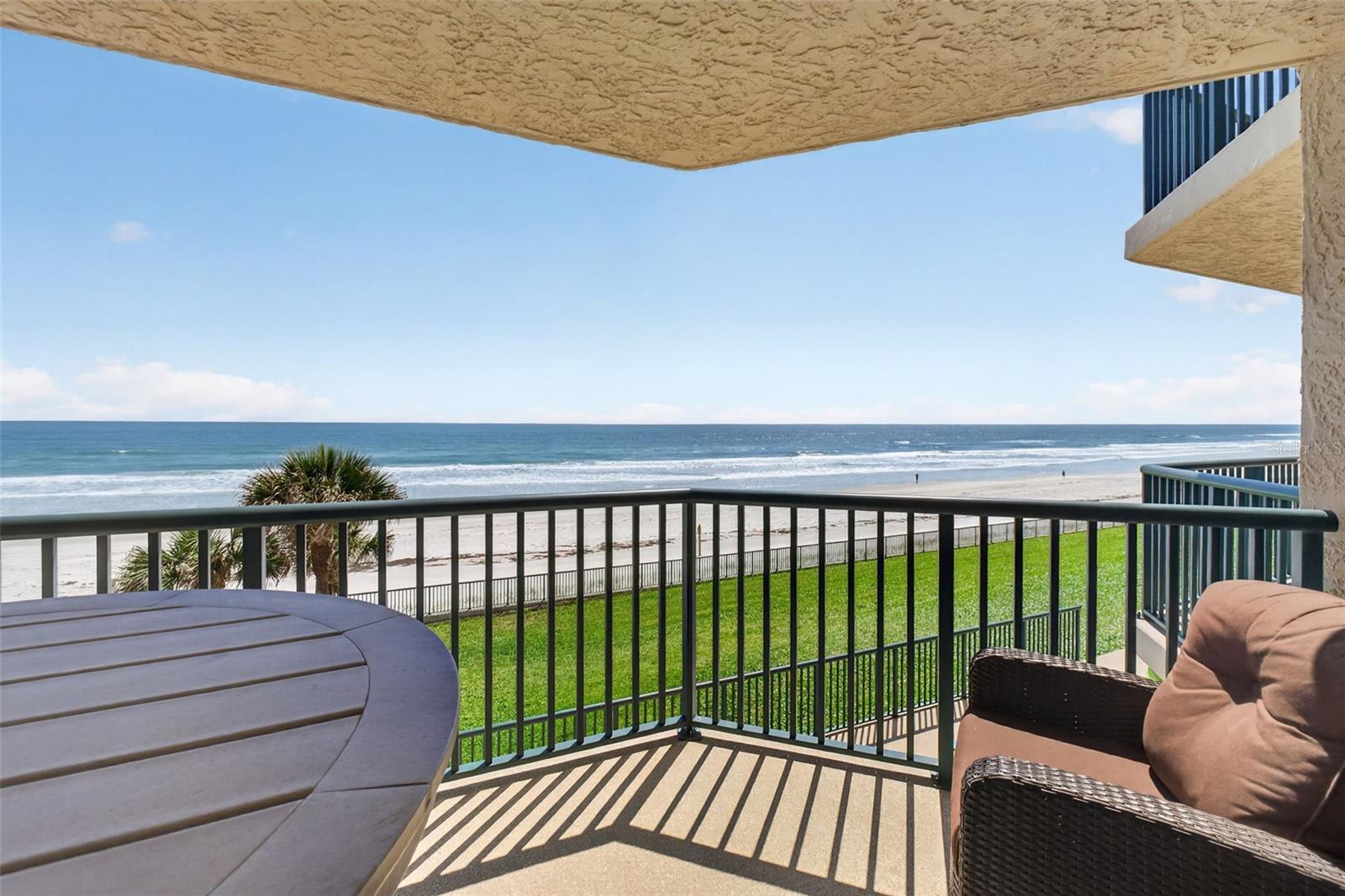 **PRICE IMPROVEMENT** Wake up to sweeping ocean views in this stunning 2-bedroom, 2-bathroom direct oceanfront condo voted “Best Condo” two years in a row! This fully furnished residence showcases a sleek, modern interior, featuring stone countertops, soft close cabinets and drawers, stainless steel appliances, a double oven, and a built-in wine refrigerator.

The spacious primary suite offers breathtaking Atlantic Ocean views with its own sliding glass doors, creating the ultimate private retreat. The primary suite also includes TWO closets. Enjoy peace of mind with major updates already completed, including a new HVAC system, a 2021 water heater, hurricane-impact sliding glass doors, and ALL BUILDING ASSESSMENTS ARE PAID IN FULL. The building has also been recently renovated, including an updated seawall.

Additional highlights include an upgraded laundry room with a utility sink and thoughtfully designed living spaces that maximize natural light and coastal views. Residents enjoy resort-style amenities, including a pool, jacuzzi, and private access to the Atlantic Ocean just steps from your door. Schedule your showing today!

This award-winning condo offers the perfect blend of luxury, convenience, and true oceanfront living—completely move-in ready.