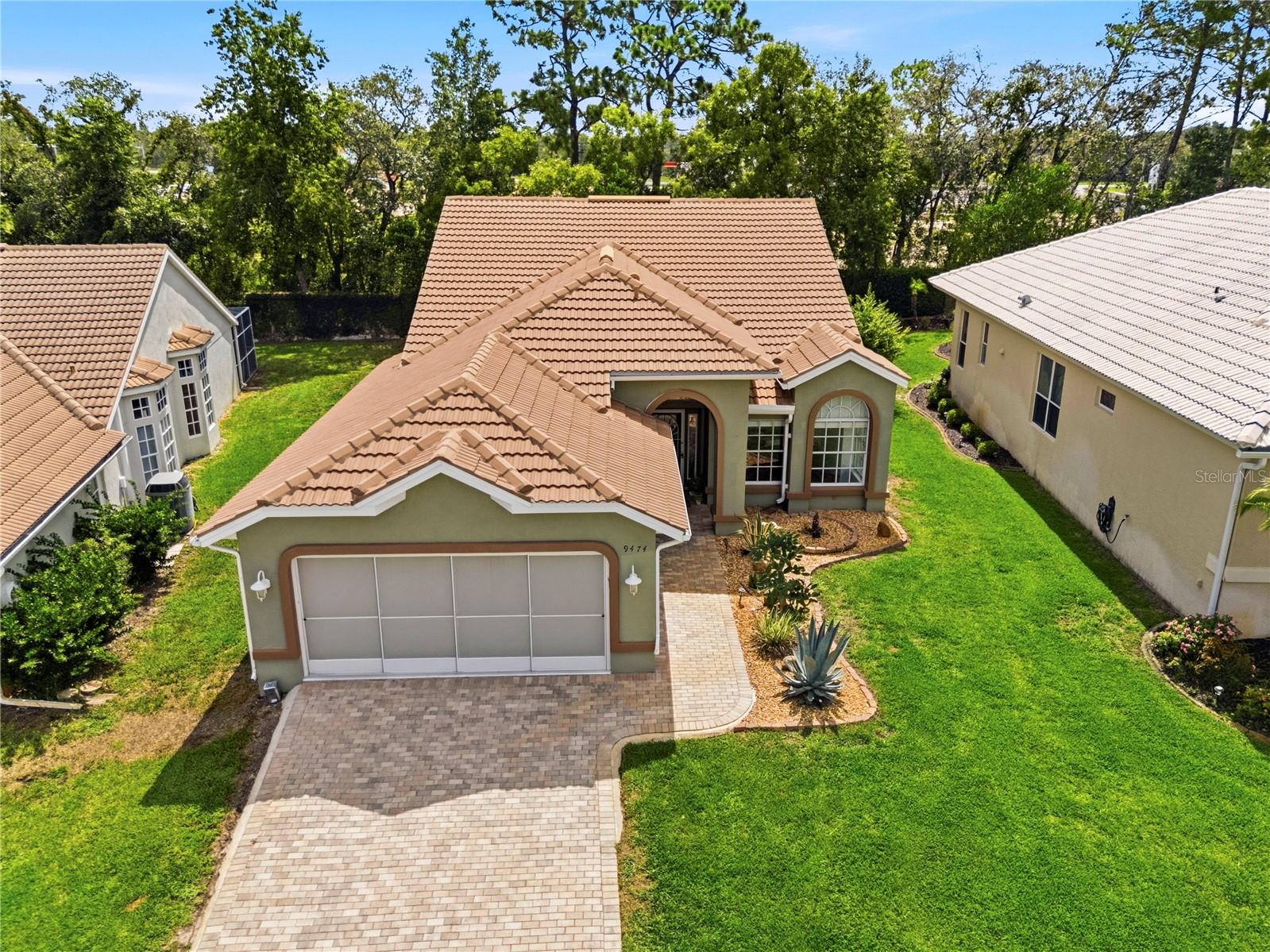 Welcome to Glen Lakes Golf & Country Club, where comfort, convenience, and an exceptional Florida lifestyle come together. This beautifully updated, maintenance-free 3-bedroom, 2-bath villa with a 2-car garage offers the perfect blend of elegance and easy living. Step inside to discover soaring high ceilings and an open, spacious split-bedroom floor plan designed for both comfort and privacy. The home features a generous dining area, a bright breakfast nook surrounded by large windows that fill the space with natural light, and an oversized Florida room ideal for year-round relaxation, entertaining guests, or simply enjoying the peaceful surroundings. Attractive flooring flows throughout the home with absolutely no carpet, creating a clean, modern look that is both stylish and easy to maintain. Thoughtful updates provide peace of mind and modern comfort, including a new tile roof (2019), new HVAC system (2022), updated primary and guest bathrooms, and updated window treatments. The home's curb appeal shines with professionally designed landscaping completed in 2022, complemented by a beautiful brick-paver driveway leading to the spacious 2-car garage. Enjoy Florida living at its finest from the screened outdoor living area, offering a private and tranquil setting backed by a large privacy hedge wall. Just steps away, residents of this villa community enjoy access to a private neighborhood pool, perfect for relaxing and socializing with neighbors. Whether you're seeking a full-time residence or a seasonal Florida retreat, this move-in-ready villa is an outstanding opportunity and can be sold fully furnished for added convenience. Located within the prestigious Glen Lakes Golf & Country Club, residents enjoy a gated community with 24-hour guarded security and access to a private 18-hole championship golf course, ranked among Florida's top golf courses. Optional social and golf memberships provide access to golf, tennis, pickleball, a fitness center, dining, and an active social calendar. HOA fees include exterior maintenance, cable television, high-speed internet, and access to the private neighborhood pool, allowing for truly carefree living. Enjoy a vibrant lifestyle with numerous clubs and activities, including the Kayak Club, Italian Club, Garden Club, and many others. Conveniently located just minutes from Pine Island Beach, approximately 45 minutes from Tampa International Airport, and within easy reach of some of Florida's top-rated Gulf Coast beaches. This exceptional villa offers a rare opportunity to enjoy the sought-after Glen Lakes lifestyle in a beautifully maintained home. Schedule your private showing today and experience all that this wonderful property has to offer. No carpeting in this home, all new hard flooring. No social membership required. New Exterior paint and pressure washed 6-year-old tile roof