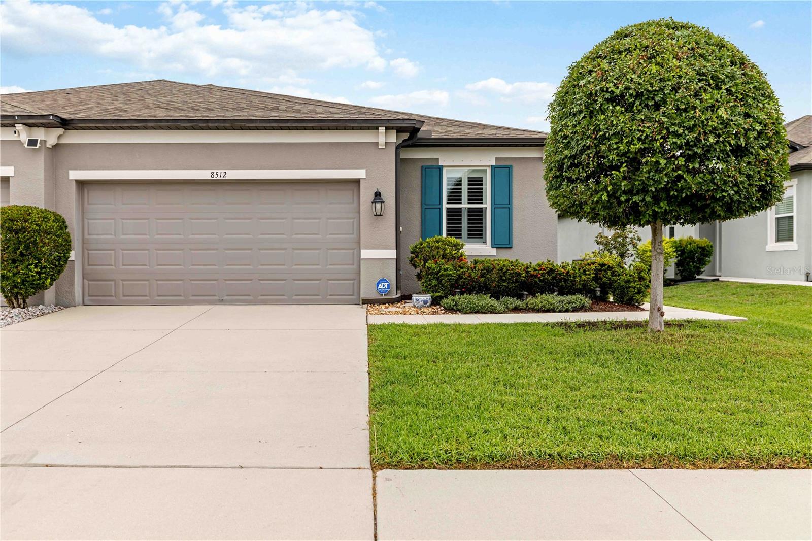 Welcome to Hidden Creek, one of Sarasota's best-kept secrets—offering modern construction, low-maintenance living, low HOA fees, and NO CDD fees in an unbeatable location just minutes from Lakewood Ranch, Waterside, UTC, and I-75.
Built in 2019 by M/I Homes, this meticulously maintained 3-bedroom, 2-bath villa offers 1,619 square feet of thoughtfully designed living space with upgrades throughout. From the moment you arrive, you'll appreciate the beautifully tiled front entry, attractive curb appeal, and pride of ownership that is evident in every detail.
Inside, the open-concept floor plan is enhanced by elegant plantation shutters, a smart thermostat, security system, and abundant natural light. The spacious kitchen is designed for both everyday living and entertaining, featuring ample cabinetry, a walk-in pantry, and a premium Waterdrop under-sink filtration system. The seamless flow from the kitchen to the dining and living areas creates an inviting atmosphere for gatherings with family and friends.
The private primary suite offers a relaxing retreat with generous closet space and a well-appointed ensuite bath, while two additional bedrooms provide flexibility for guests, a home office, or hobby room.
Enjoy Florida living year-round from the screened lanai overlooking peaceful community surroundings—perfect for morning coffee, evening cocktails, or simply enjoying Sarasota's beautiful weather. 
Hidden Creek is a highly sought-after community known for its modern homes, community amenities, and exceptional location near shopping, dining, golf, top-rated schools, medical facilities, and the area's world-famous Gulf Coast beaches. Residents enjoy easy access to University Town Center, Waterside Place, downtown Sarasota, and everything Lakewood Ranch has to offer while benefiting from the significant savings of NO CDD fees.
Eligible buyers may also qualify for Florida's Hometown Heroes Housing Program, which can provide valuable down payment and closing cost assistance for teachers, healthcare workers, first responders, military personnel, and many other workforce professionals—making homeownership even more attainable.
Whether you're searching for a primary residence, seasonal retreat, or low-maintenance Florida lifestyle, this move-in-ready villa offers the perfect combination of location, upgrades, value, and peace of mind. Don't miss this opportunity to own one of the most desirable maintenance-free villas in Hidden Creek.