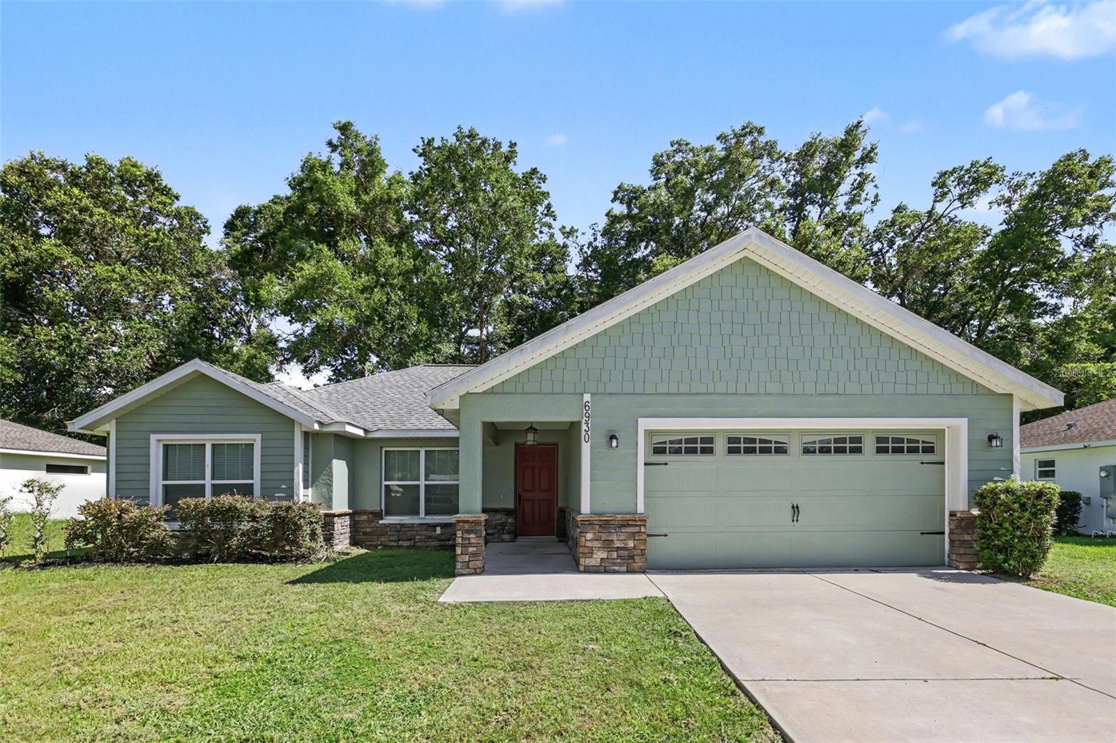 Welcome to this inviting three-bedroom, two-bathroom home located in the desirable Oak Ridge Estates. This residence features a classic traditional floorplan, highlighted by tall ceilings in the main living room that create a bright and airy atmosphere. The kitchen has been beautifully updated with elegant granite countertops and sleek stainless steel appliances, providing a functional and stylish space for everyday cooking. Additionally, the primary bedroom is thoughtfully designed and includes a large walk-in closet for ample storage. You are tucked away in a quiet enclave just five minutes from Publix, local shopping centers, and a variety of top-rated restaurants, ensuring you never have to travel far for the essentials.