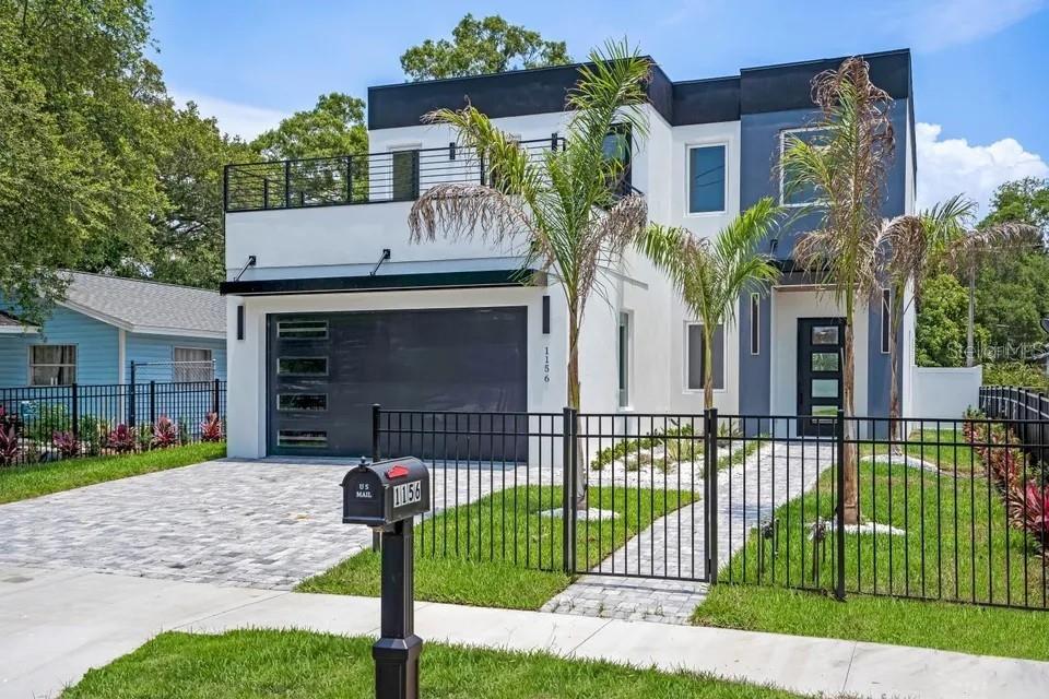 Own a Sarasota Bay view home today. Introducing 1156 Cocoanut Avenue, a newly built modern residence that delivers bold architecture, refined finishes, and effortless urban living in the heart of Sarasota. Designed for today’s lifestyle, this striking home blends clean lines, open spaces, and elevated craftsmanship into a seamless expression of contemporary luxury. The home features five bedrooms and four bathrooms across 2,882 square feet. You are greeted by large-format, marble-look tile throughout the first floor for a seamless, elegant flow.
From the moment you arrive, the home’s sleek exterior and architectural presence make a powerful first impression. Inside, light-filled interiors unfold with expansive open-concept living areas, high ceilings, and thoughtfully selected finishes that feel both high end and inviting. The Gourmet chef’s kitchen is equipped with top-of-the-line Café appliances featuring elegant gold accents, premium cabinetry, and seamless Calcutta quartz countertops throughout the home. The waterfall center island seats 6 comfortably, ideal for family meals, casual gatherings, or hosting large dinner parties. The layout is ideal for modern living—entertaining, everyday comfort, and stylish retreat. Having two spacious living rooms, one on each floor, offers versatile entertaining or relaxed family time.
The primary suite is a true retreat with a spa-style bath, soaking tub, walk-in shower, and generous his-and-hers closets. Large-format tile flooring, energy-efficient construction, a two-car garage, and modern architectural details enhance both form and function. 
Outdoors, a private resort-style backyard awaits with a custom Pebble Tec pool, covered patio with tongue-and-groove ceiling plus stylish full summer kitchen, and a fully fenced lot with rear alley access for added privacy and ease. Additional features include a 2-car garage, energy-efficient design, and modern architectural finishes that emphasize comfort and style. Every element has been intentionally curated to reflect quality and design-forward living, creating a home that feels fresh, refined, and effortlessly functional. 
 Ideally located in Sarasota’s sought-after downtown corridor, near Sarasota’s vibrant downtown, you’re just moments from the Rosemary District, world-class dining, art galleries, theaters, shopping, and the city’s renowned cultural scene. Enjoy quick access to the waterfront, marinas, and Sarasota’s award-winning beaches, all while being tucked into a rapidly growing and highly sought after neighborhood. You are just steps from the Bay and the Van Wezel through the beautiful Pioneer Park path. 
This is a rare opportunity to own a newly built modern home in one of Sarasota’s most dynamic locations. Schedule your private showing today and experience the lifestyle waiting for you! Would also make an excellent Airbnb. Call today for a showing!