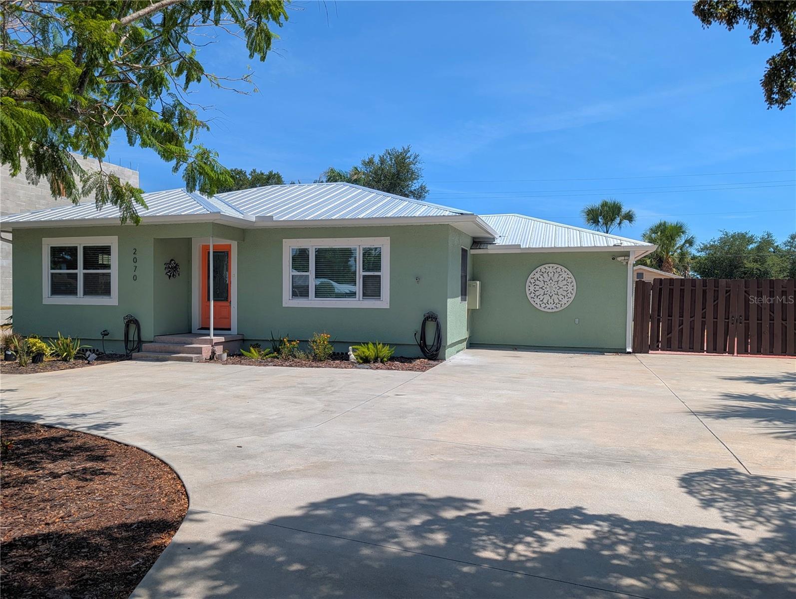 When location matters the most, this home delivers. Perfectly located just off Tamiami (41) near Sarasota Memorial Hospital in the highly desirable Arlington Park Area. You can easily navigate anywhere in Sarasota from here. Completely renovated recently with 3 Bedrooms and 2 full Baths, plus a Living Room and a Family Room. All flooring is easy care Luxury Vinyl. The open Kitchen features Stainless Steel Appliances, Silestone Quartz counters with plenty of storage including the convenient island for meal prep and dining. Both Bathrooms have walk-in showers.  Ready to entertain outside? Relax under the covered Pergola with lights and fans while you make gourmet Bar-B-Que meals with the grill. Then for the ultimate finish to your day, relax in the large Salt-Water Spa! One car garage with ample extra parking. The backyard is fully fenced for privacy. Pet Friendly! Up to 2 dogs under 35 lbs each with monthly pet fee. Applications apply. 1st and Security. Washer & Dryer hookups in the laundry with extra storage. Manager is the Owner. Available Now!