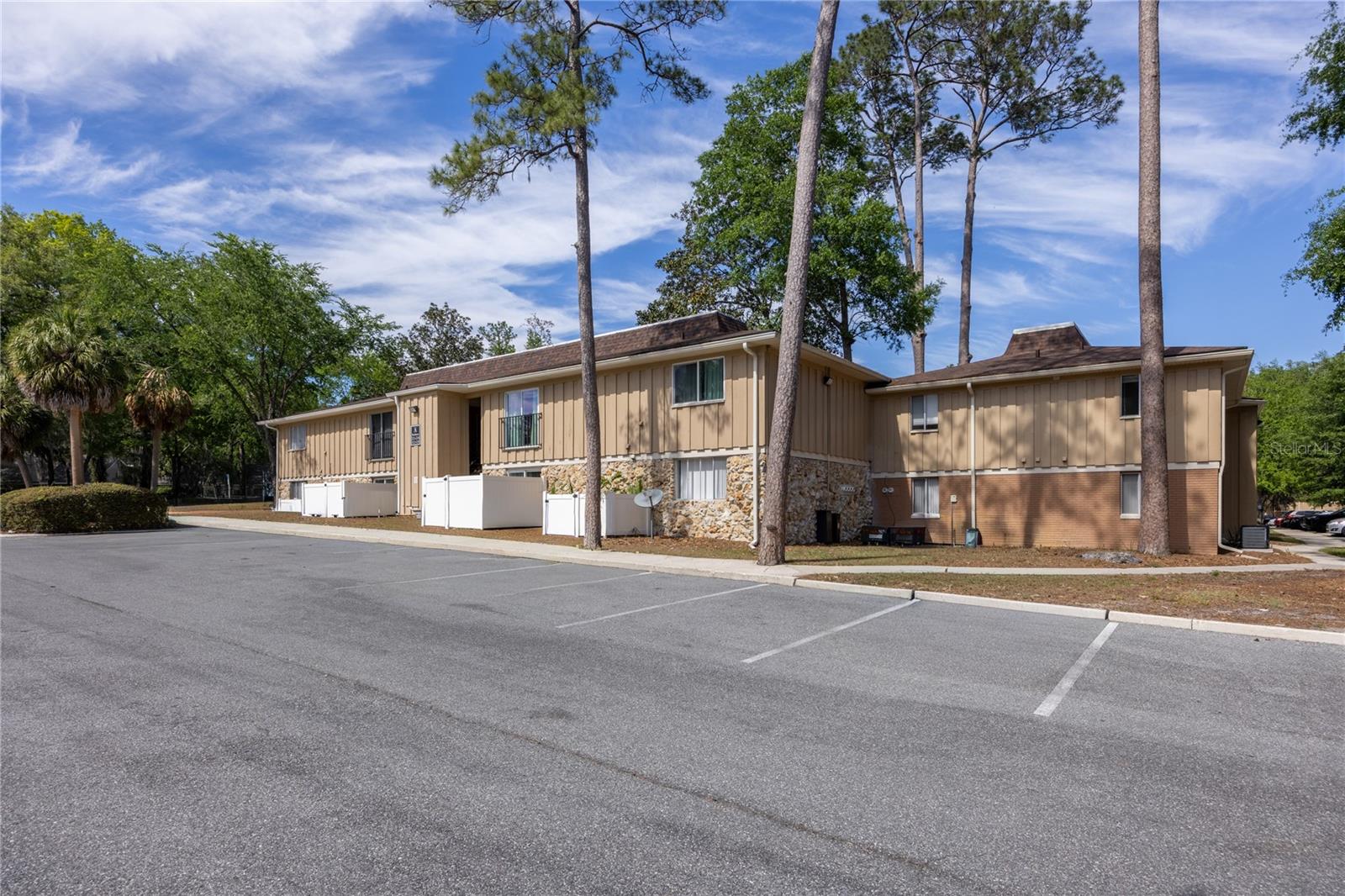 This charming 1-bedroom, 1-bath condo offers 630 sq ft of comfortable living in a convenient first-floor location. Fresh updates include  new electrical panel (June 2026), new carpet in bedroom (LVP and Tile everywhere else), a new primary bedroom window, and a new microwave, making it move-in ready from day one.

Enjoy a private, fenced back patio with a gate that opens directly to a peaceful walkway and gazebo—perfect for relaxing outdoors or easy access for pets. Inside, you’ll find a functional layout with an in-unit laundry closet (washer & dryer included) and plenty of natural light.

Located just off Newberry Road near Ballyhoo and Publix, this condo offers quick access to UF—whether by car, bus, or bike. The community features a wide range of amenities including a pool, clubhouse (free to rent!), fitness center, tennis courts, dog park, and outdoor grilling area.

Perfect for a student, first-time buyer, or investor, this is a great opportunity in a prime Gainesville location!