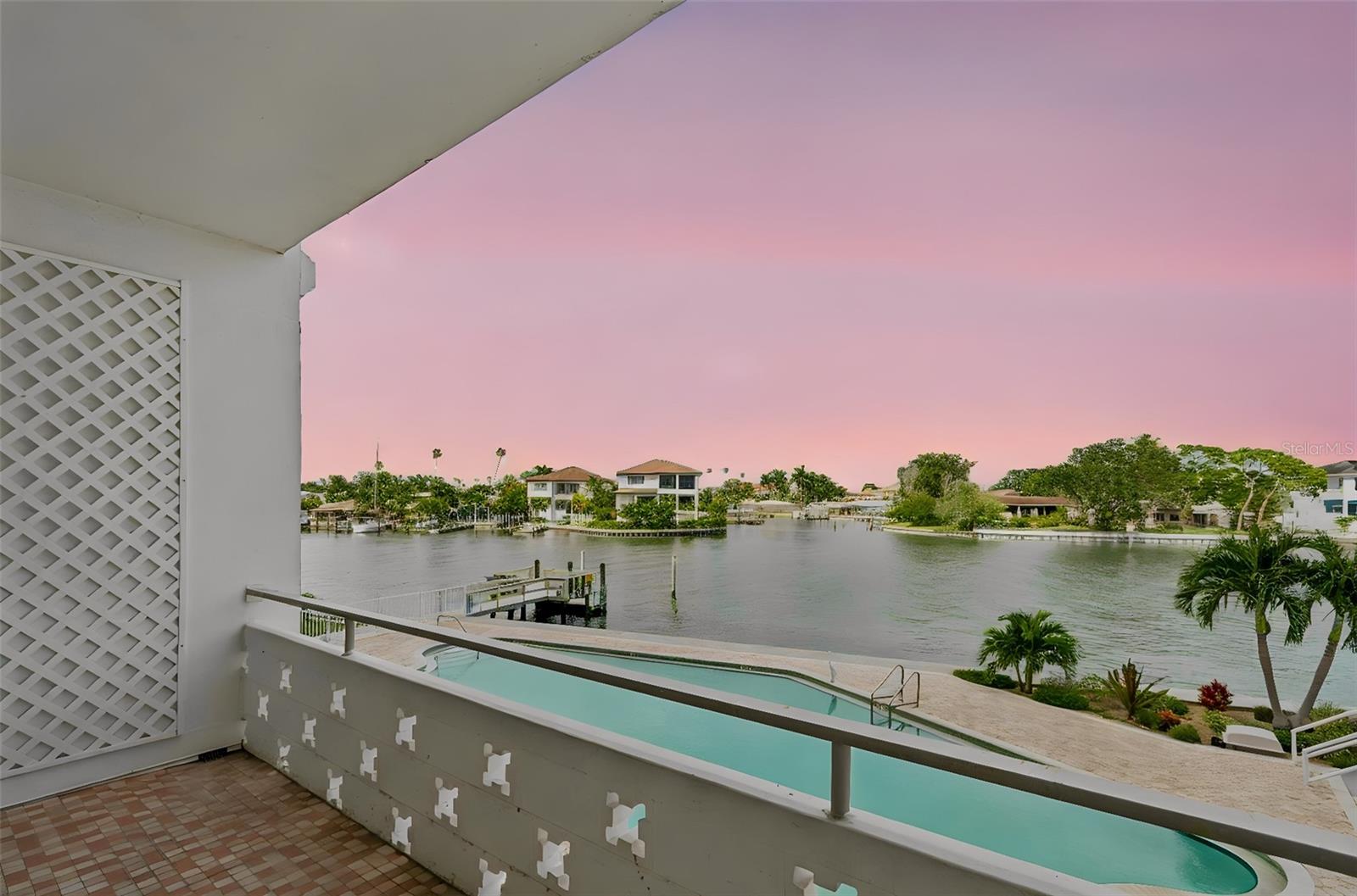 Waterfront living at its finest on exclusive Snell Isle! Open the door to breathtaking panoramic views of the Intracoastal Waterway and Tampa Bay — visible from the living room, dining room, and master bedroom. This beautifully renovated 2nd-floor condo features a remodeled master bath with soaking tub and walk-in shower, an updated kitchen, and a large guest bedroom with walk-in shower. Bare floors throughout give the next owner a blank canvas to choose their perfect flooring. Step onto your private balcony for sweeping views of the pool and waterway. Electric hurricane shutters provide peace of mind year-round. All of this just a short bike ride to downtown St. Petersburg's world-class museums, restaurants, cultural events, and nightlife. Location, lifestyle, luxury — all in one.