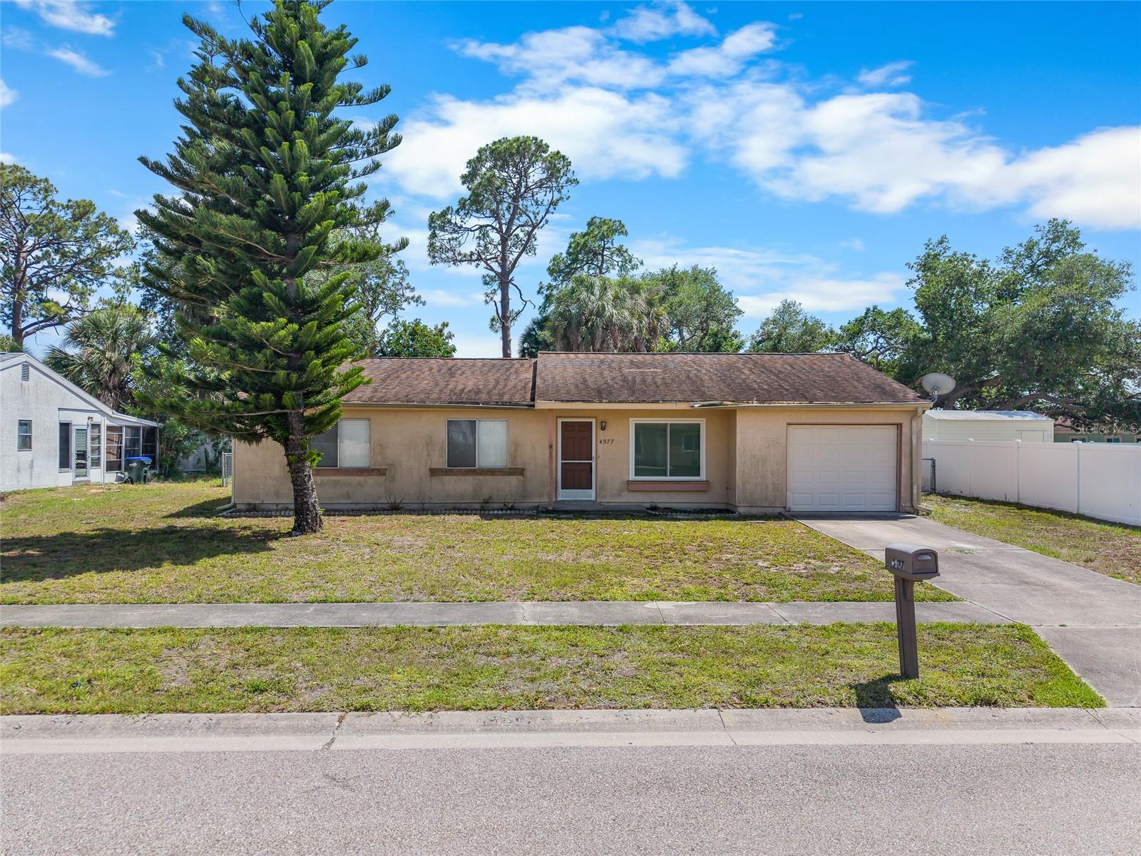 Do not miss this home that’s ready for a little TLC. It features 3 bedrooms and two baths, updated appliances, some bathroom updates, a 10 year old roof and sits on almost one quarter acre. Enjoy the open floor plan, screened lanai and ample fenced yard. This home is blocks away from McKibben Park which maintains a basketball court, tennis court, racquetball courts, shuffleboard, playground, and pavilion available for rent. Additionally, there is a canoe/kayak launch for adventure along the Blueway.  Or, enjoy Pine Park a 2.5 acre park offering a pavilion, playground, volleyball court, and paved walking trails. Truly in the heart of North Port, the home is minutes from Home Depot, Lowes, Cocoplum Plaza with Dick’s Sporting Goods, Hobby Lobby and Publix. Wellen Park, home of the Atlanta Braves Spring Training and a plethora of dining and shopping is a few miles down the road.
