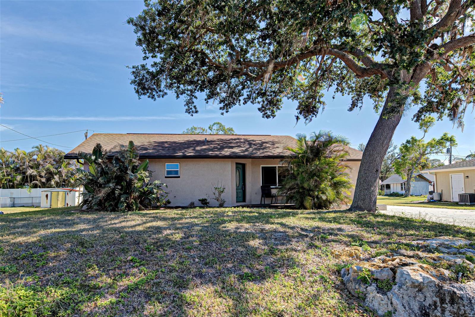 One or more photo(s) has been virtually staged. Welcome to this beautifully updated home featuring 3 bedrooms and 2 full baths. Step inside and admire the bright layout with vaulted ceilings and luxury vinyl plank flooring throughout, offering both style and durability. The split floor plan ensures privacy, with the luxurious primary suite offering French doors that lead to a serene retreat. The master bath is a spa-like oasis, complete with a jacuzzi tub, touch-activated fog-free mirrors, dual vanities, and plenty of space to unwind. The guest bathroom also has a Jacuzzi tub and a spacious layout. For peace of mind the big items have been taken care of and include an updated kitchen, the Roof was installed in 2021, Water Heater and AC installed in 2022 and an Impact-resistant front window for added safety during storms. Enjoy the Extra-large parking pad ideal for your RV or boat, with an outlet for RV hook-up.  Enjoy the Florida room filled with natural light and extra space to relax. The backyard has a shed for storage and there is space to add a pool, making it ideal for creating your outdoor oasis. Don’t miss this opportunity to own a beautifully updated home in a fantastic location just 5 miles to Venice Beach and close to shopping, golf and many restaurants. Schedule your showing today and make 3187 Galiot Rd your own!