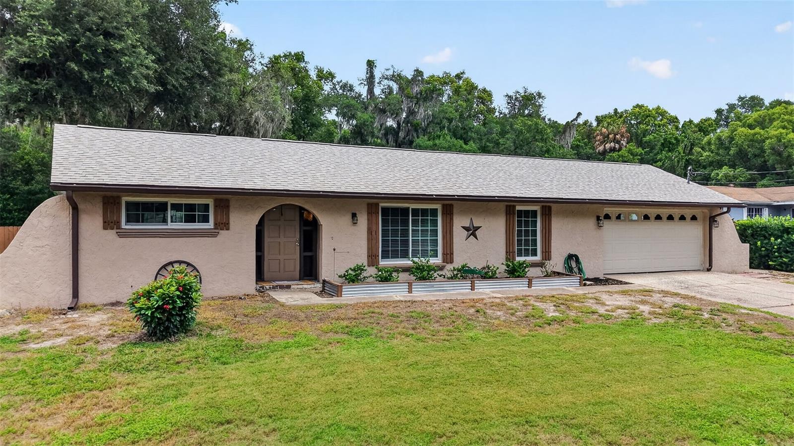 Welcome to this beautifully maintained 3-bedroom, 2-bath home offering 1,539 living square feet on a spacious 0.37-acre lot, ideally located just 2 miles from The Villages. This move-in ready home features a desirable split floor plan, abundant natural light, and a spacious living area perfect for everyday living and entertaining. The kitchen offers white cabinetry, white appliances including a side-by-side refrigerator, dishwasher, and stove, along with a cozy eat-in dining area and an adjacent dining space. Just beyond the main living area is a relaxing rear sitting room overlooking the pool and private backyard. The spacious primary suite features an ensuite bathroom, while the additional bedrooms provide comfortable accommodations for family, guests, or a home office. Step outside to enjoy Florida living at its finest with a covered patio area and a screen-enclosed oversized pool overlooking a beautiful nature preserve with no rear neighbors. Major updates have already been completed, including a recently replaced roof (2/2025), updated HVAC system and ductwork replacement (3/2025), septic system cleaned in 2024, water heater replaced in 2025, New Garage Door (7/2020), New Windows (2/2022)and recently painted interior and exterior. Located in an X flood zone, this property requires no flood insurance and offers the added benefit of NO HOA and NO CDD fees. Conveniently located near shopping, dining, golf courses, medical facilities, and all the entertainment and amenities The Villages has to offer. Priced to sell and ready for its new owner. Schedule your private showing today!