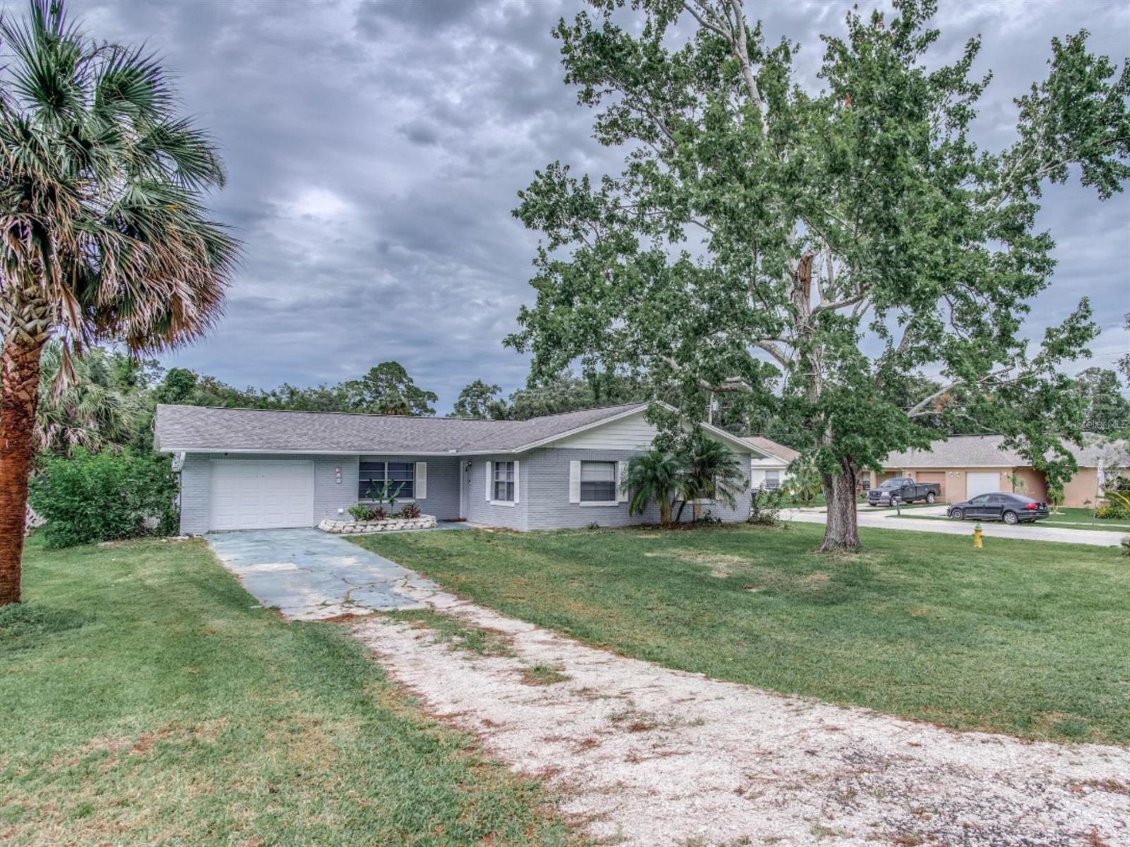 Where can you get a MOVE-IN READY THREE BED TWO BATH GARAGE home in PORT ORANGE for this price? This is the one! 1360sf of living space on a corner lot. Better still, there's a Bonus Room making this Property an easy convert to a FOUR bed home. Roof installed 2017. Concrete block construction. No HOA. Investors - current owner has had a successful rental business here for several years. Tenants are moving so be prepared to see boxes, but look past those and this place has potential. Close to colleges, Beach, Shopping, Restaurants, Medical facilities. ;Water: City