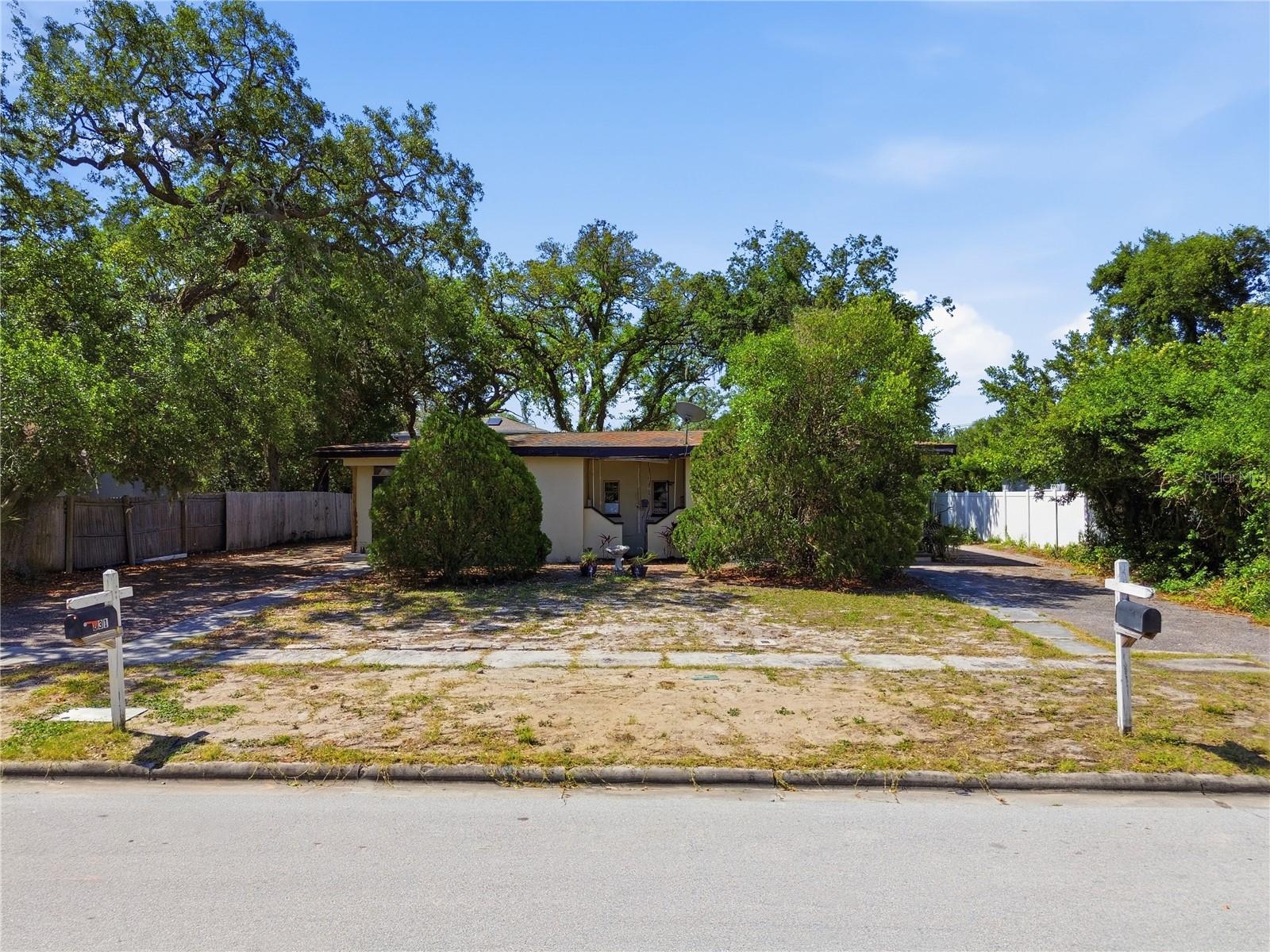 Rare Clearwater investment opportunity with multiple exit strategies. Whether you are an investor, builder, or end user looking for land value, rental potential, and future upside, this oversized property offers the flexibility to live, lease, expand, or redevelop in one of Clearwater’s active growth corridors.
Situated on an 83’ x 127’ quarter-acre lot with rear alley access, this property is currently configured as a duplex with two 1-bedroom, 1-bath units. The property has no rental history due to owner use, but projected rental potential per unit per month depends on the final use, condition, rental strategy, and market demand. Inquire for details! 
The real value is in the land, zoning, and flexibility. The property offers potential for duplex, triplex, or fourplex use, giving a future owner several possible paths to increase value: maintain the existing duplex, live in one unit and rent the other, lease both units for income, explore conversion or expansion into a triplex or fourplex, or redevelop the oversized lot with new construction. Buyer should verify zoning, permitted uses, density, rental projections, and redevelopment options with the City of Clearwater.
The existing block construction and recent updates — including HVAC, cabinetry, and appliances — allow for continued use while preserving long-term upside. This makes the property especially appealing for buyers who want income potential now with the ability to plan future improvements or redevelopment.
Location continues to drive demand. The property is conveniently positioned within a short drive to Clearwater Beach and the Gulf, with easy access to Tampa International Airport, Downtown St. Petersburg, shopping, dining, and major employment corridors. This central location supports strong long-term rental appeal and future resale value.
Large lots with this level of flexibility — live-in potential, income-producing use, and redevelopment upside — are becoming increasingly rare in Clearwater.
For the buyer looking to control land, create income, and unlock future value, this is a Clearwater opportunity worth serious attention.