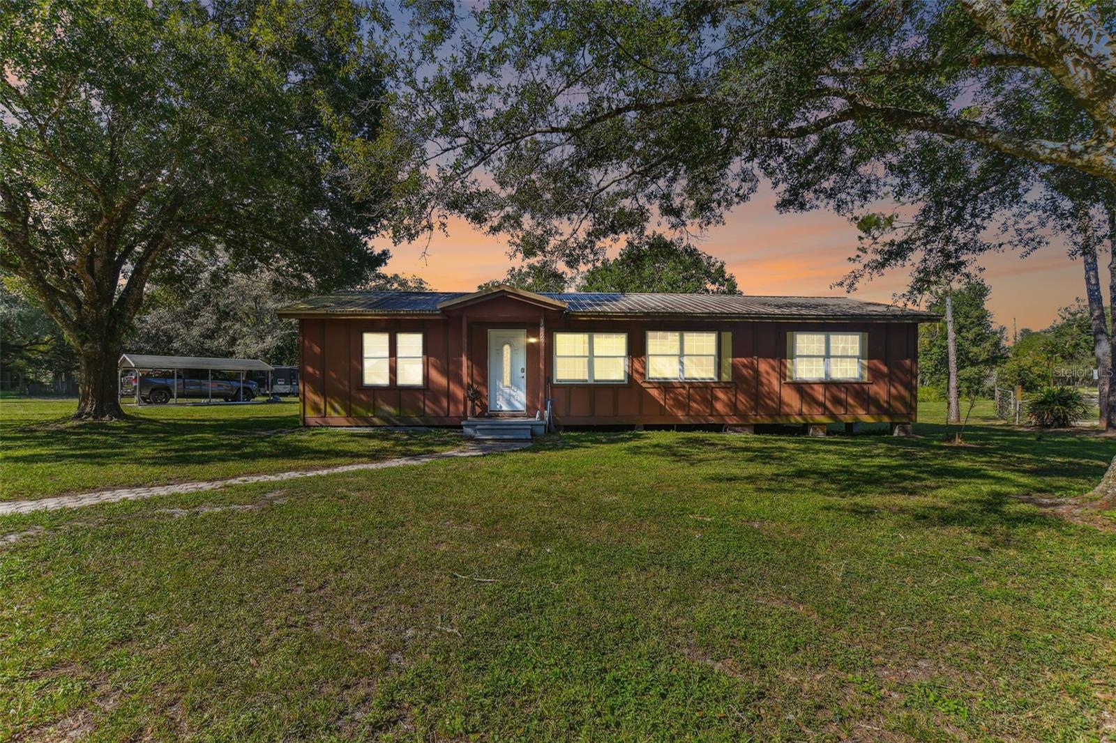 Incredible investment/equity building opportunity to own this oversized, 1.25 acre corner lot in Lutz. Located just off E Bearss Ave and minutes from I-275 for convenience to USF, shops, restaurants, and Tampa International Airport. Whether you are looking to renovate the existing home or build new, this is the property for you! Homes on similar sized lots selling for upwards of $1M. Let your imagination run free!!